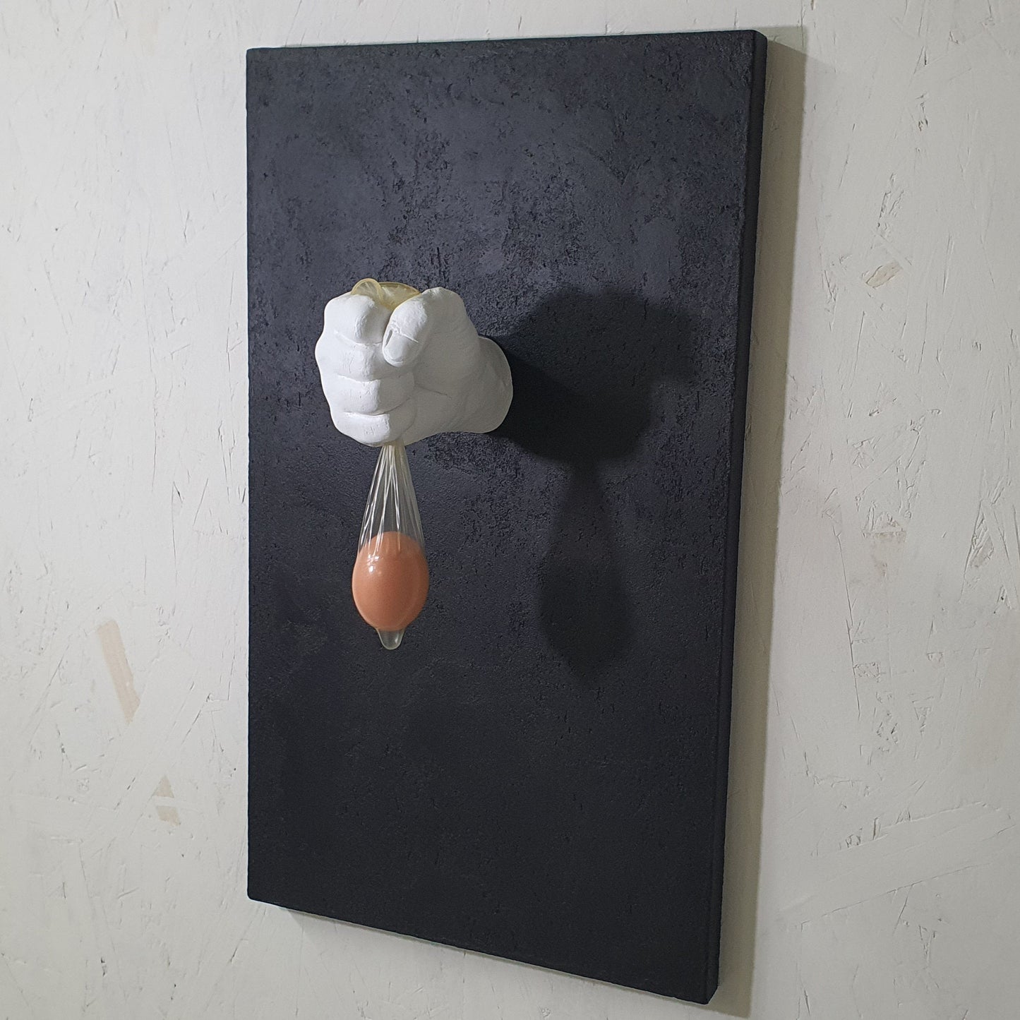 Unique contemporary art piece Vita Protetta – handmade resin and plaster installation exploring fragility of life, angled photo