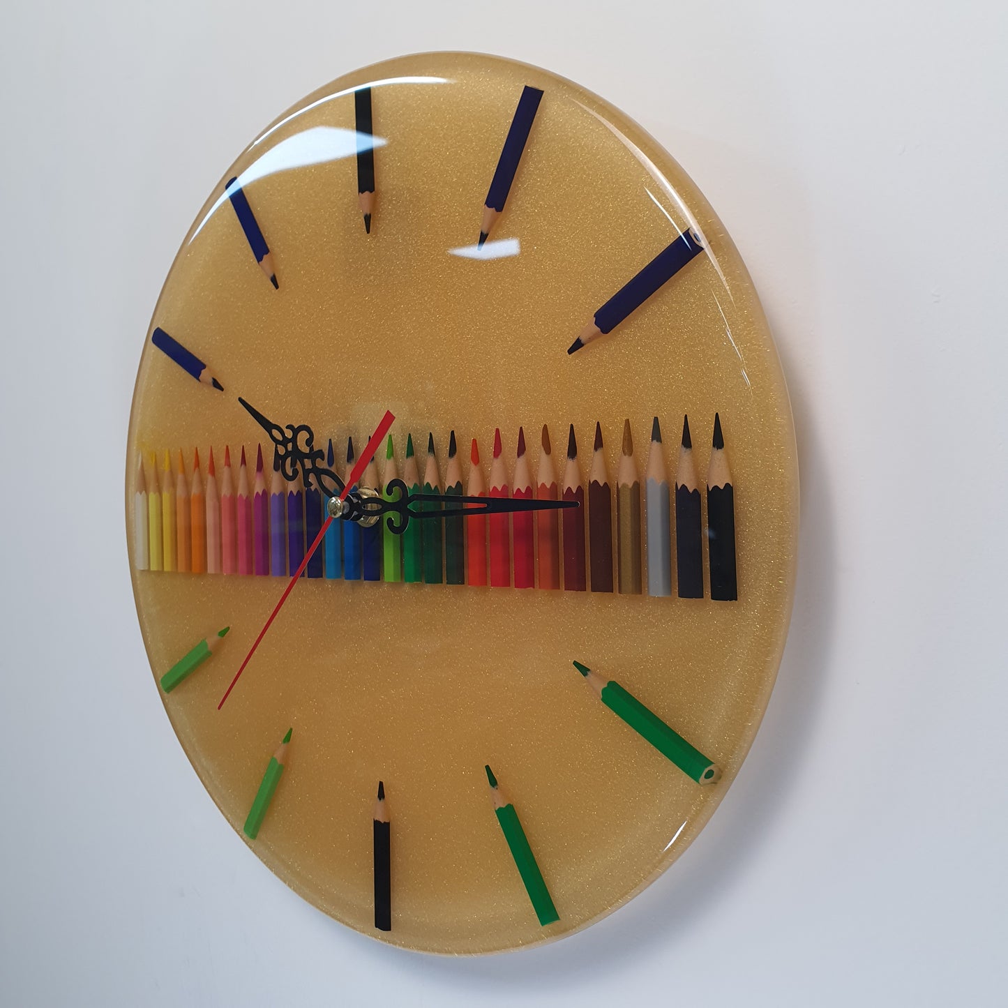 Handcrafted epoxy wall clock with vibrant pencils – side view