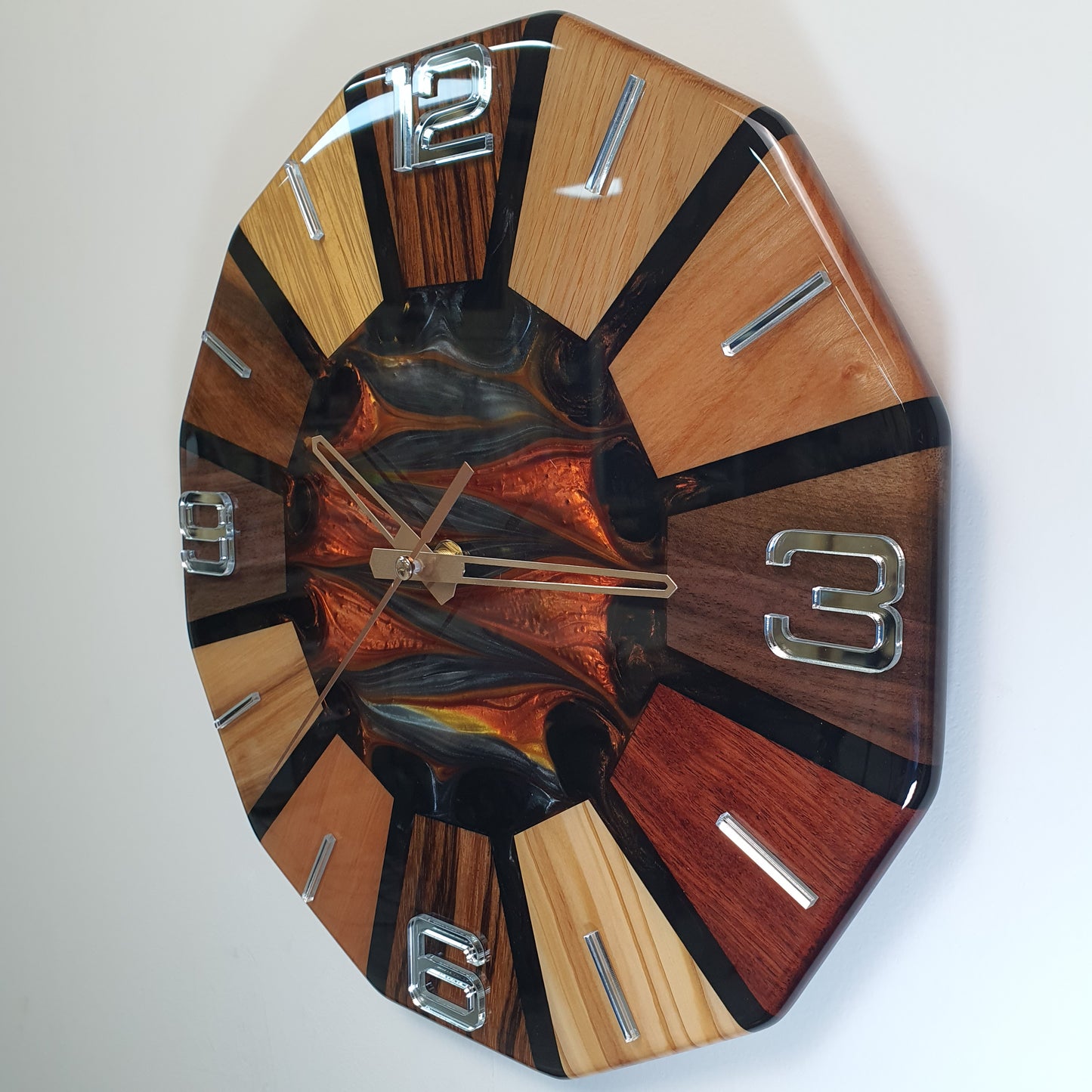 Left side angle of the Fire Core Circle clock – contrasting wood tones and resin