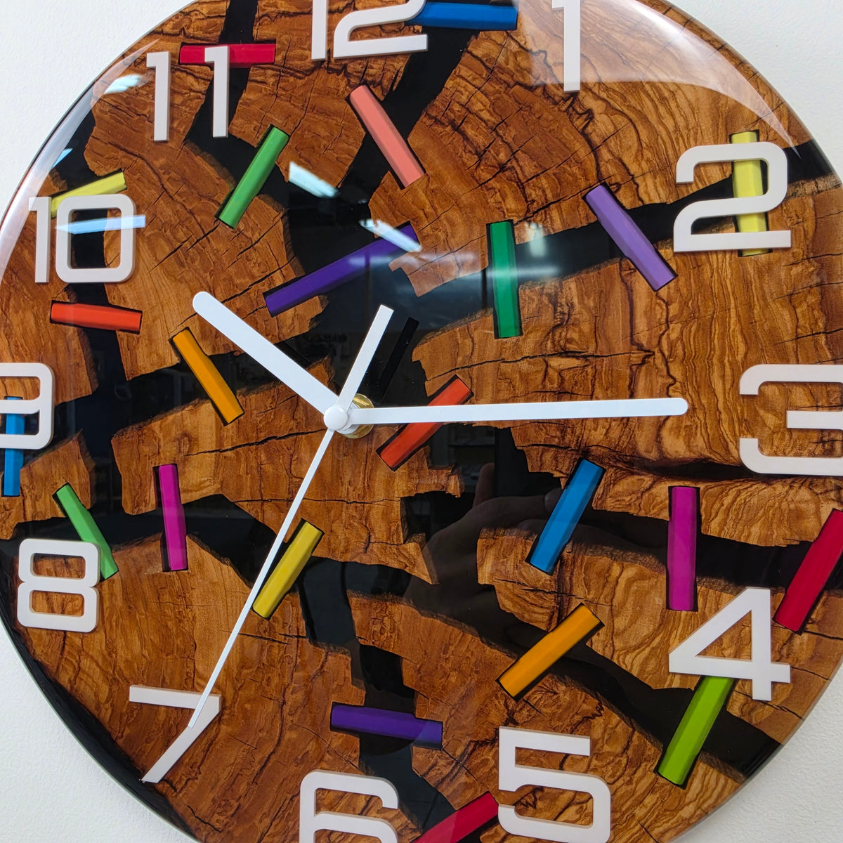 Wood Line resin art clock with irregular olive wood sections, colorful pencils and glossy transparent finish.
