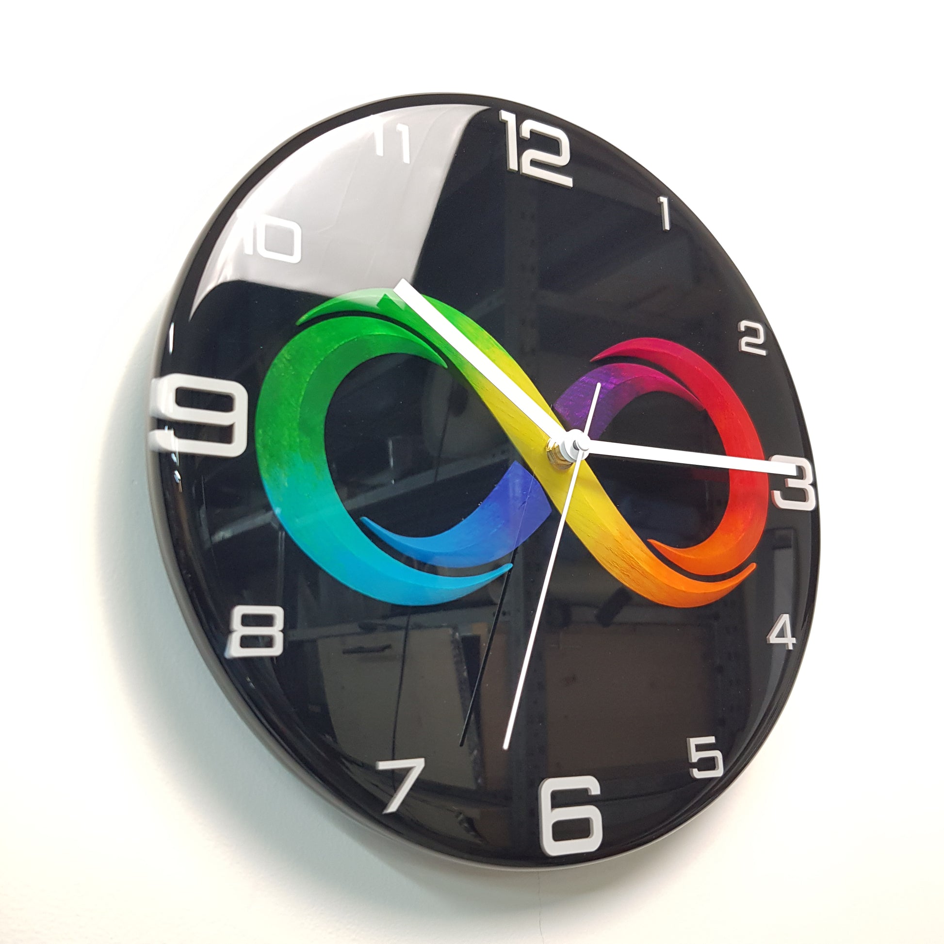 Left side angle view of the Black Infinity clock showing the glossy resin depth and embedded numbers