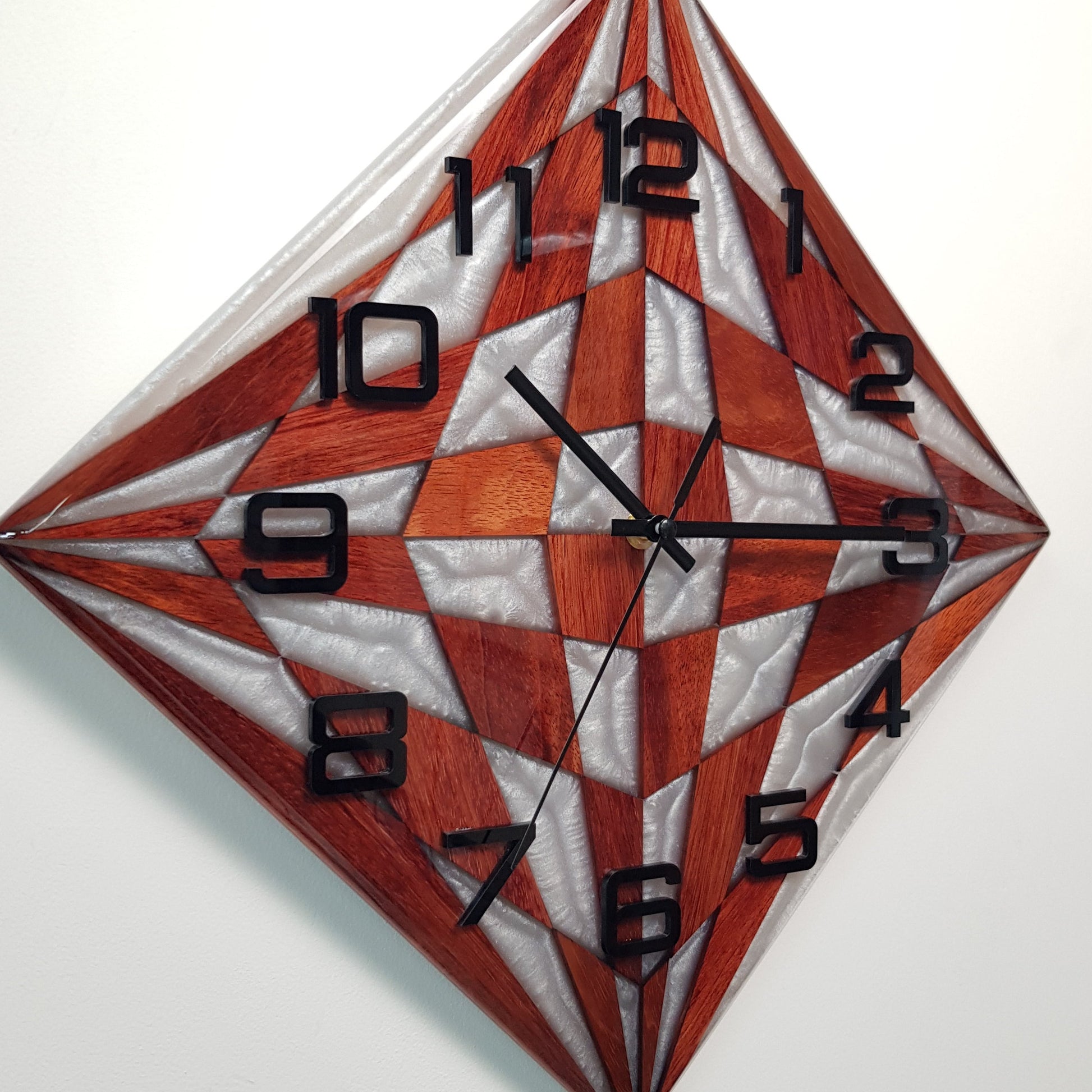 Close-up of the geometric pearl resin pattern and black plexiglass numerals