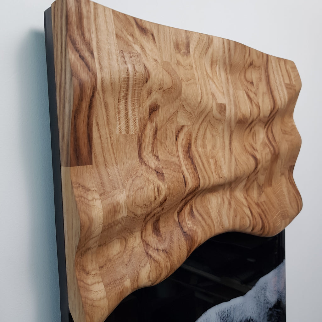 Modern oak wood and resin wall sculpture with white waves on black background