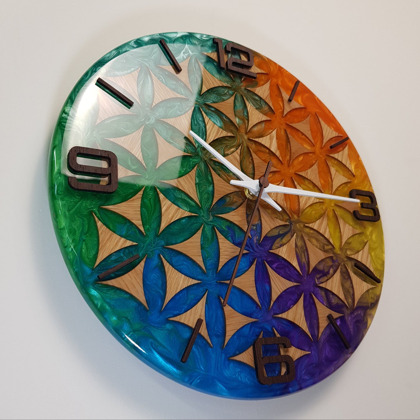 Right-angle view of Life Essence clock – showing the layered resin texture and handcrafted wooden numbers.