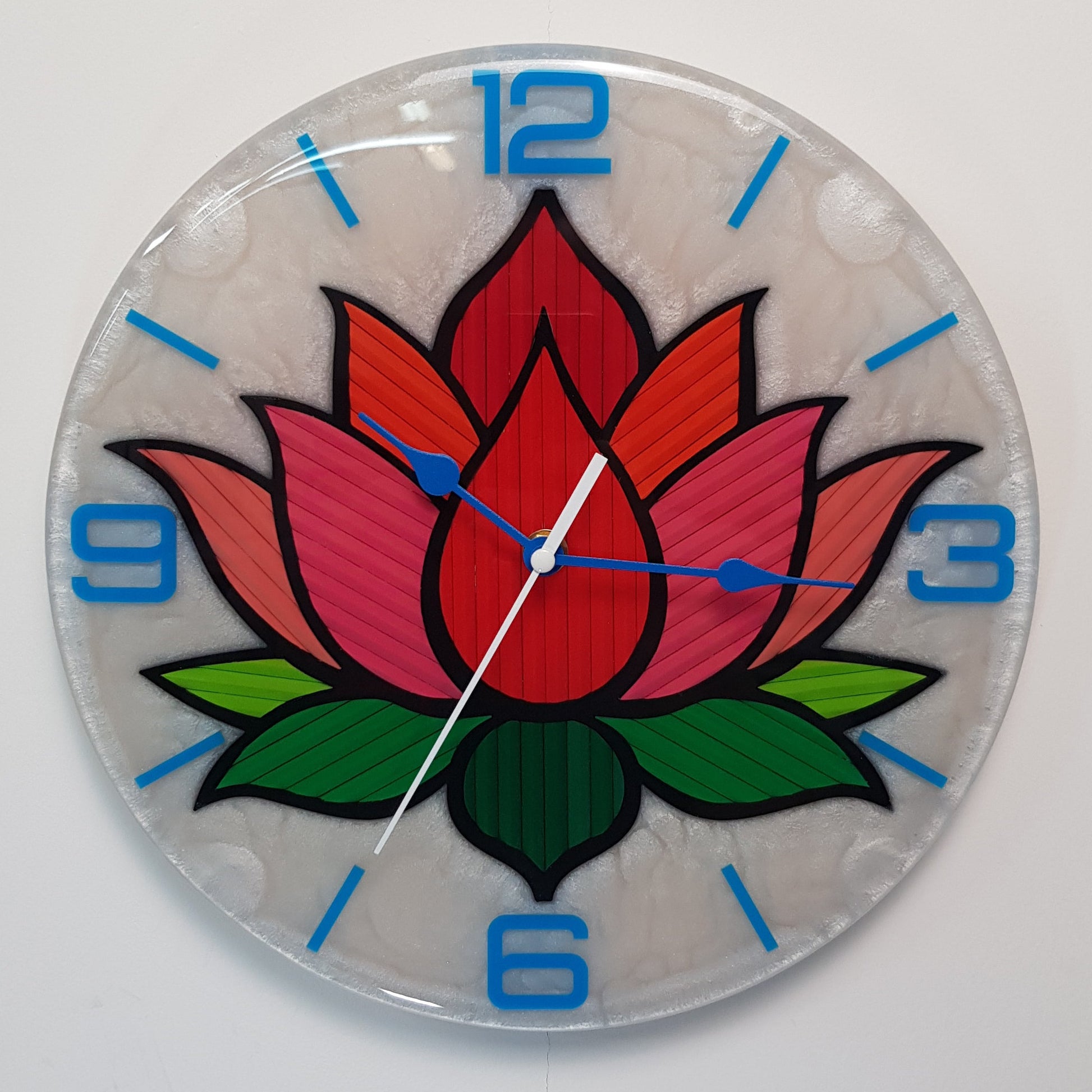 Front view of the “Creative Lotus” wall clock showing the colorful lotus flower made from pencils