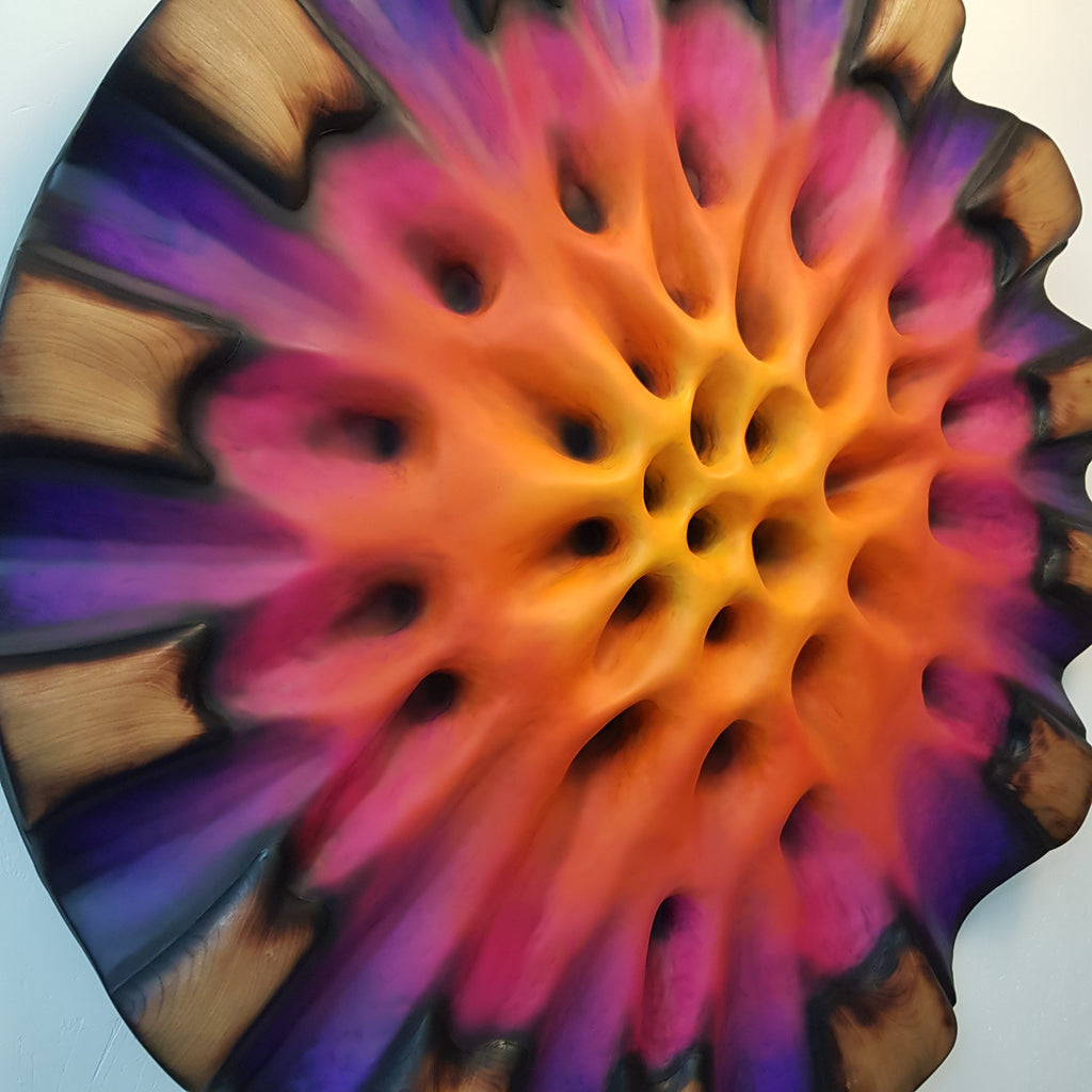 Close-up of textured center showing deep purple and magenta organic structure