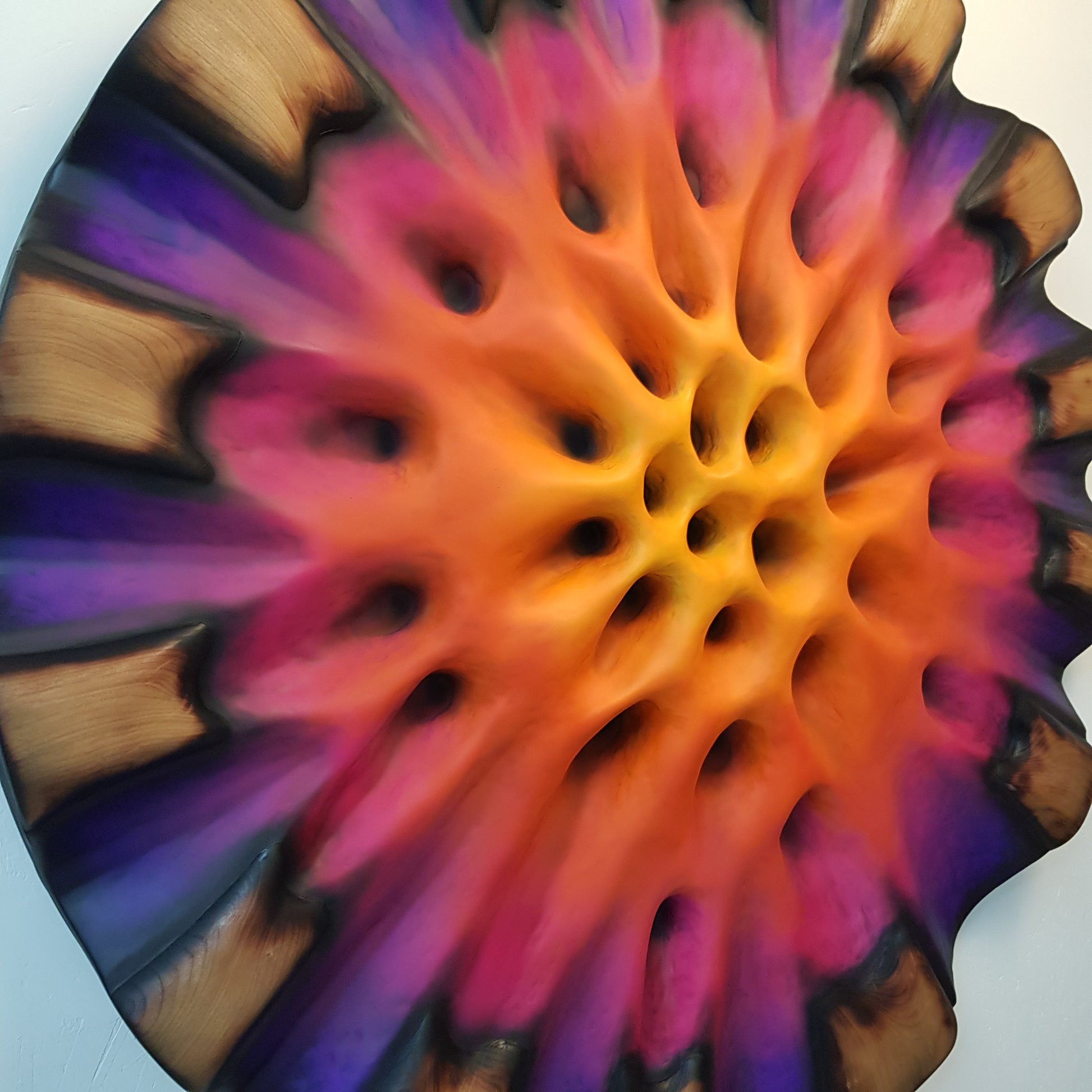 Close-up of textured center showing deep purple and magenta organic structure