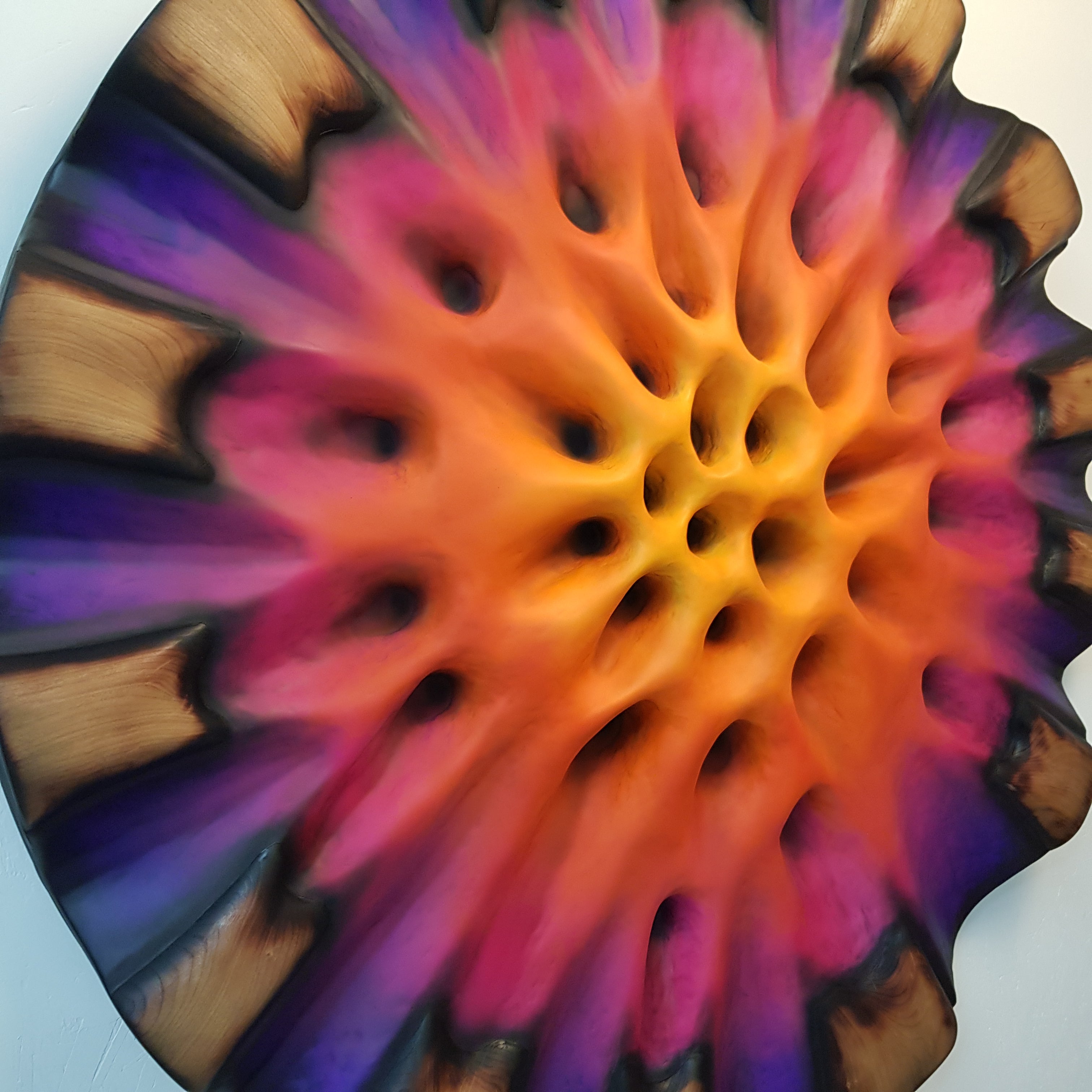 Close-up of textured center showing deep purple and magenta organic structure