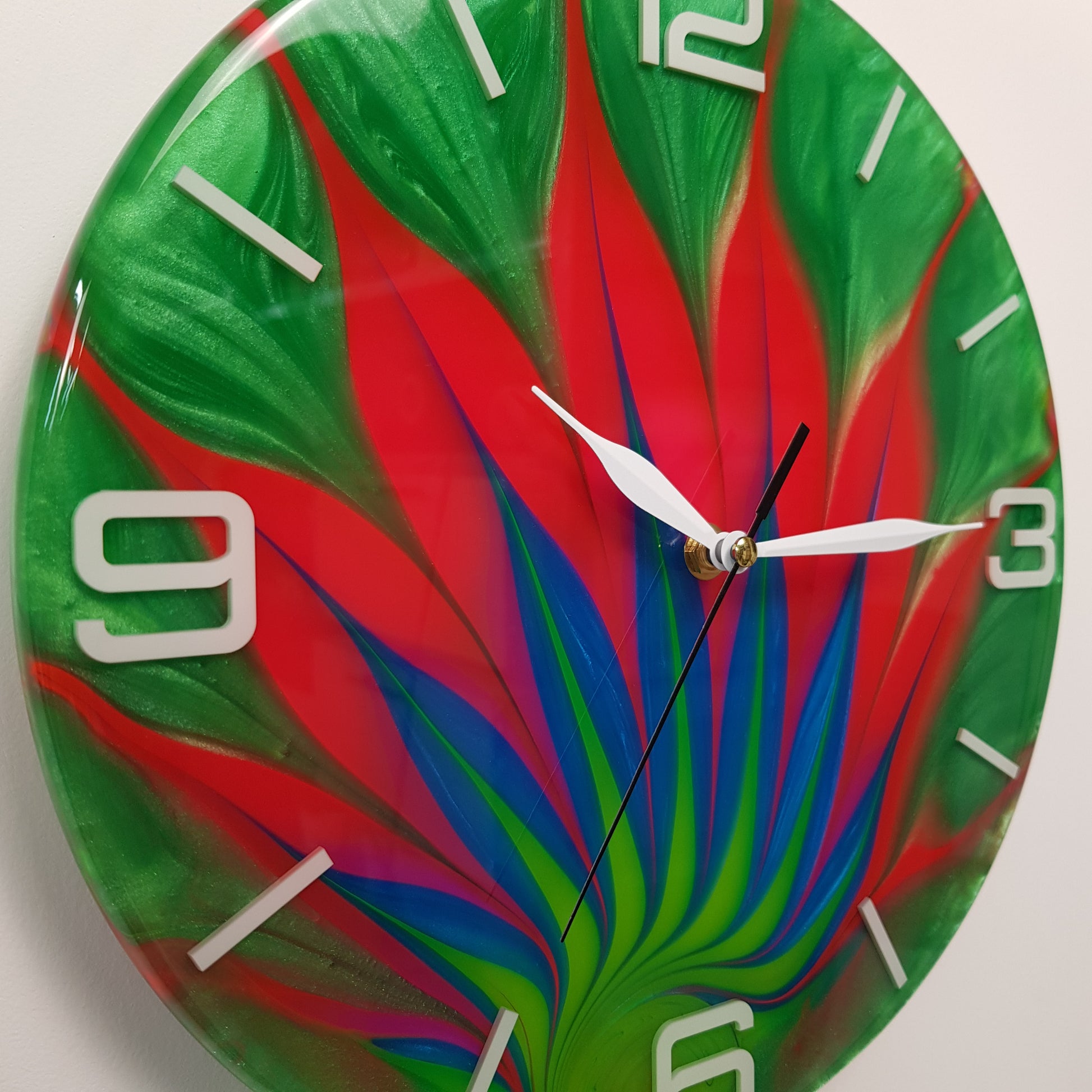 Close-up of the “Wild Leaf” clock face highlighting the swirling resin color details.