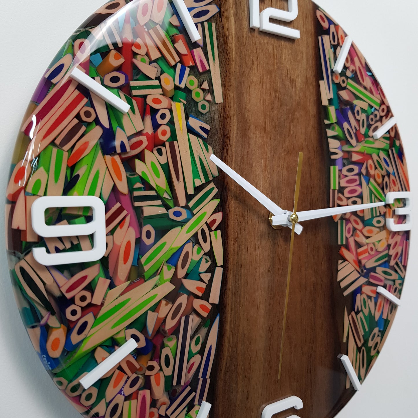 Close-up of the resin surface revealing the colorful pencil textures and glossy finish