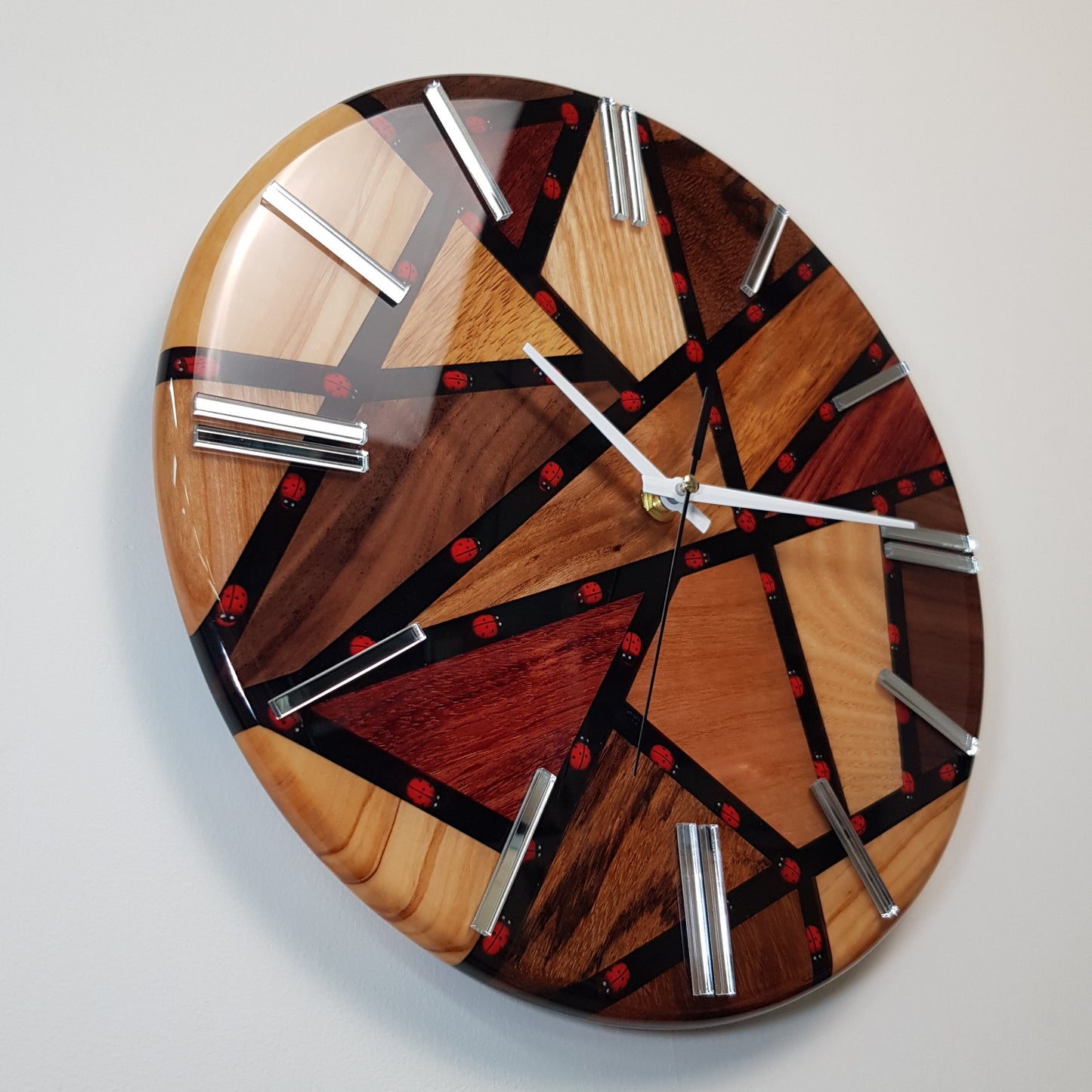 Close-up of the embedded ladybugs inside the black resin pathways