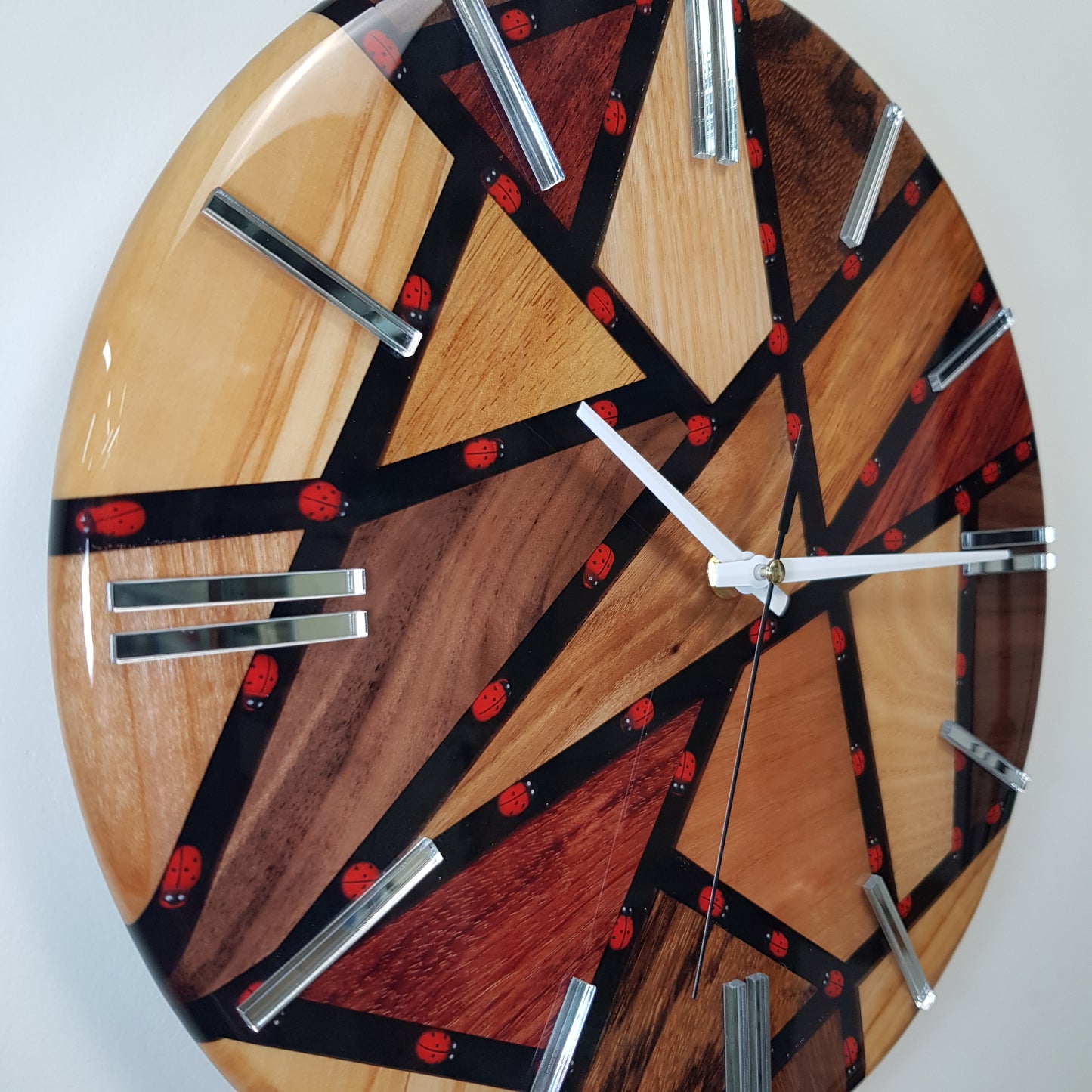 Close-up of the embedded ladybugs inside the black resin pathways