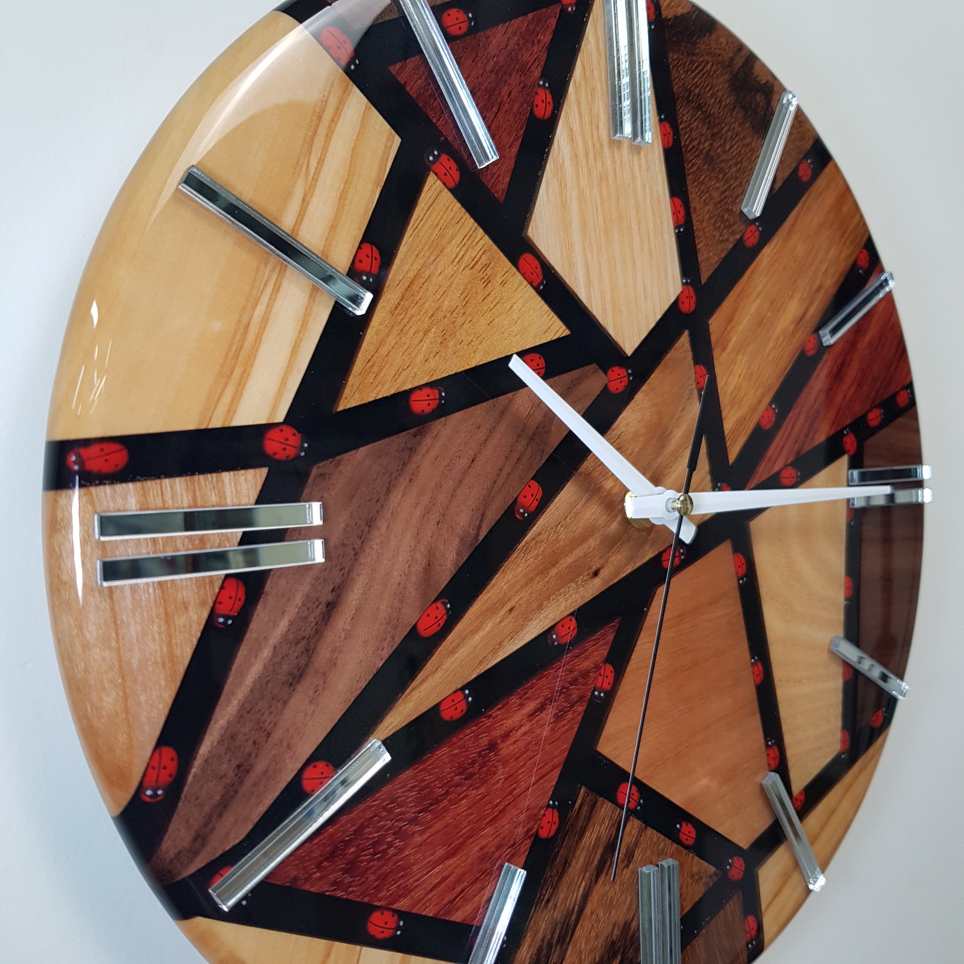 Close-up of the embedded ladybugs inside the black resin pathways