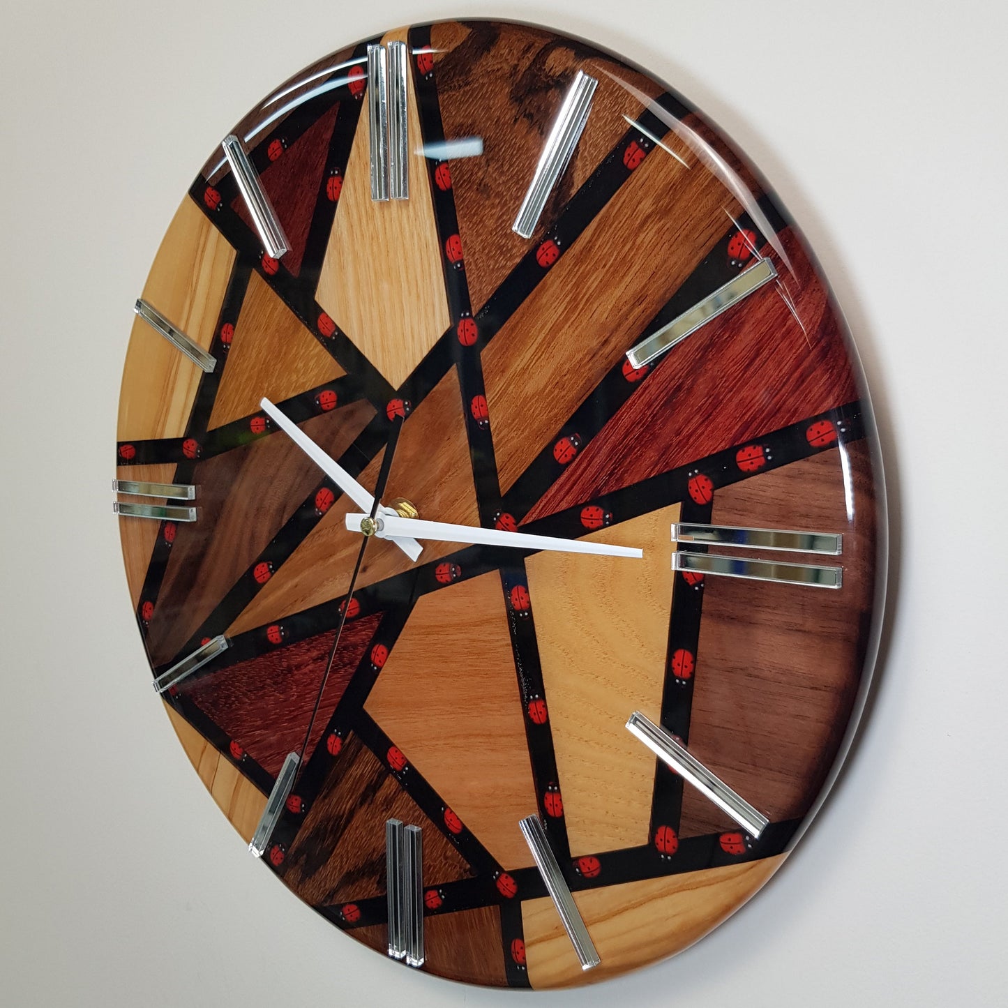 Left side view highlighting the wooden structure and mirrored hour markers