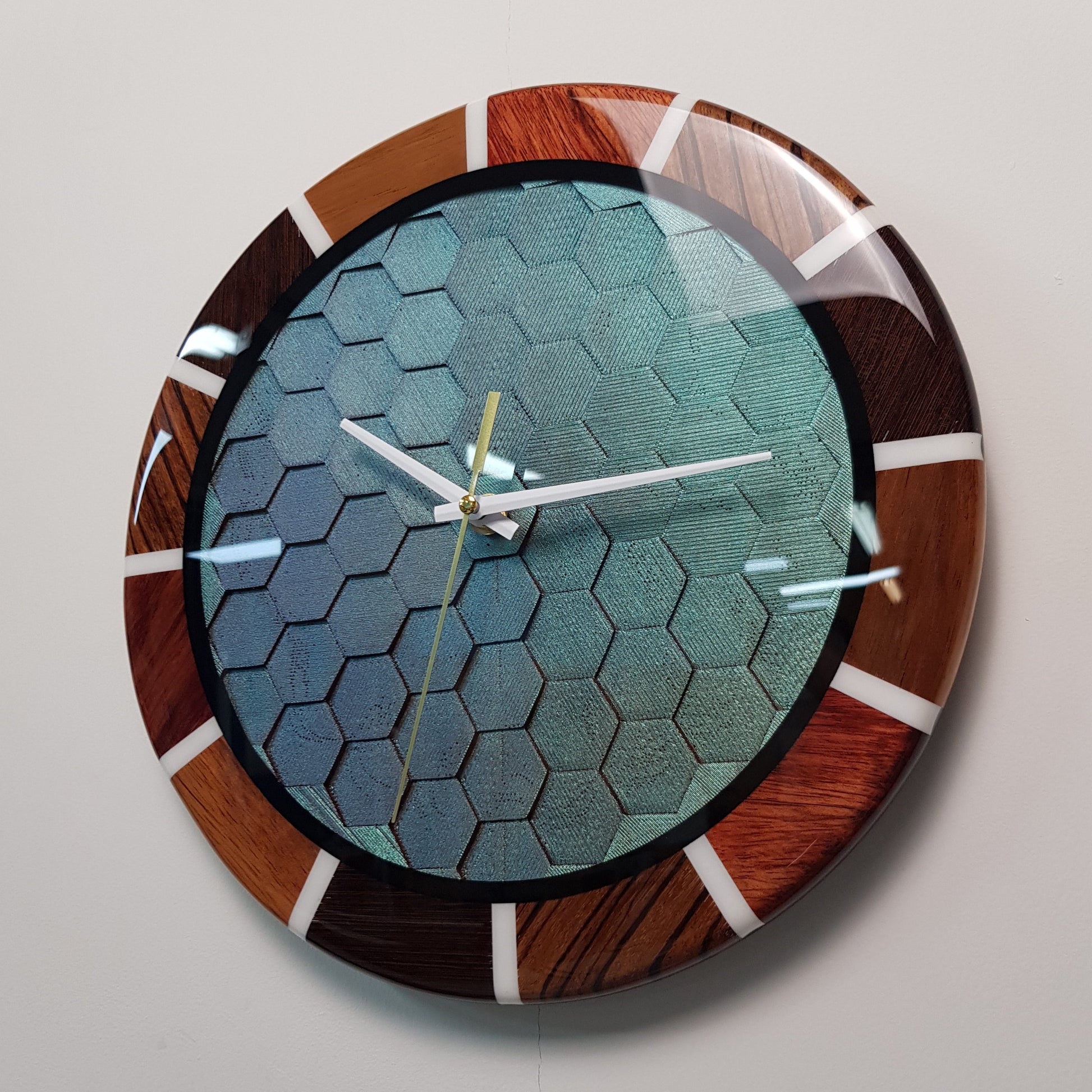 Side angle showing the glossy resin finish and white resin hour markers.