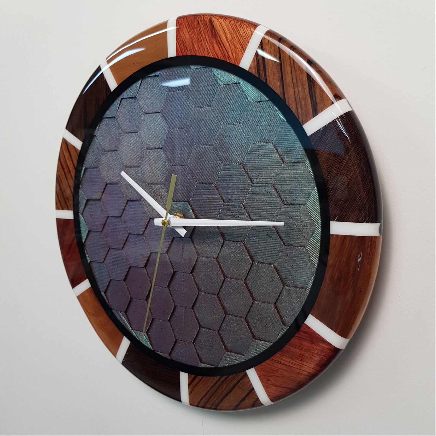 Angled close-up showing the 3D texture of the hexagonal pattern under resin.