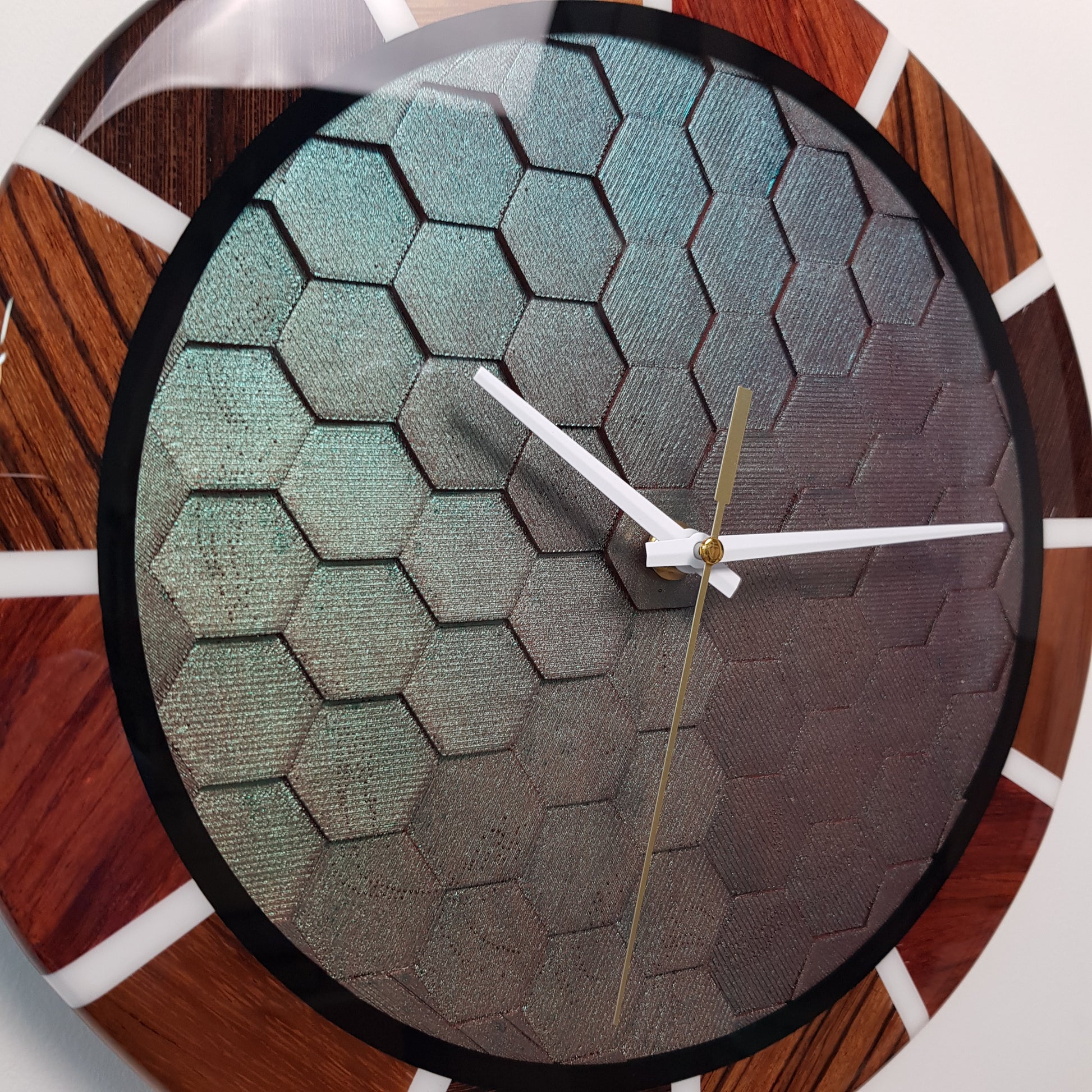 Close-up of the chameleon honeycomb texture with shifting metallic colors.