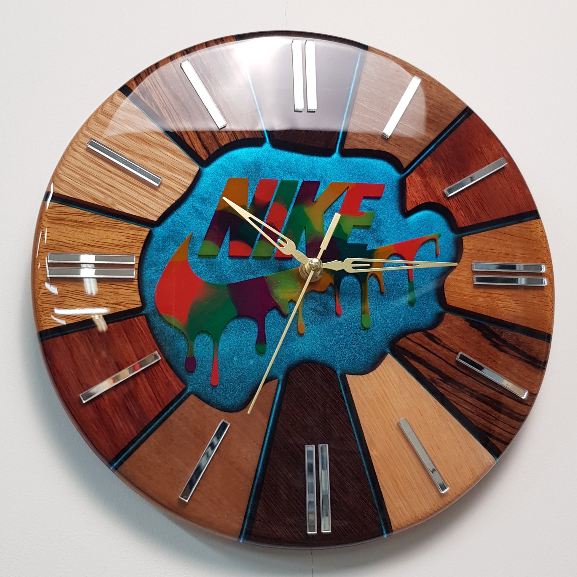 Angled perspective of the “Luxury Chaos – Color Strike” clock showing the depth of the resin layer, vivid colors and handcrafted wooden segments.
