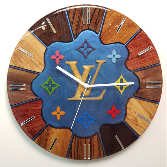 Front view of the “Noble Spectrum” wall clock showing the colorful central motif and exotic wood ring.