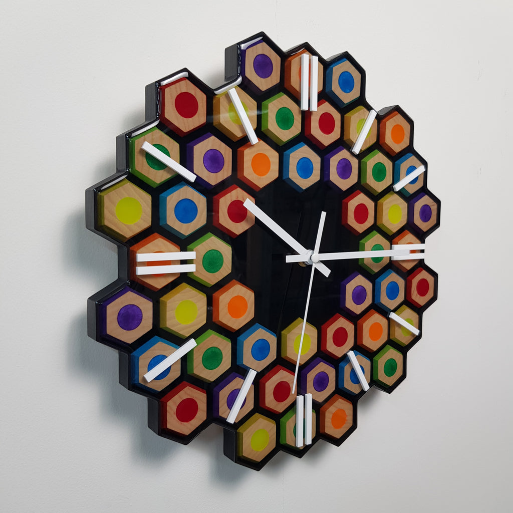 Side angle of handcrafted ash wood resin clock with geometric design