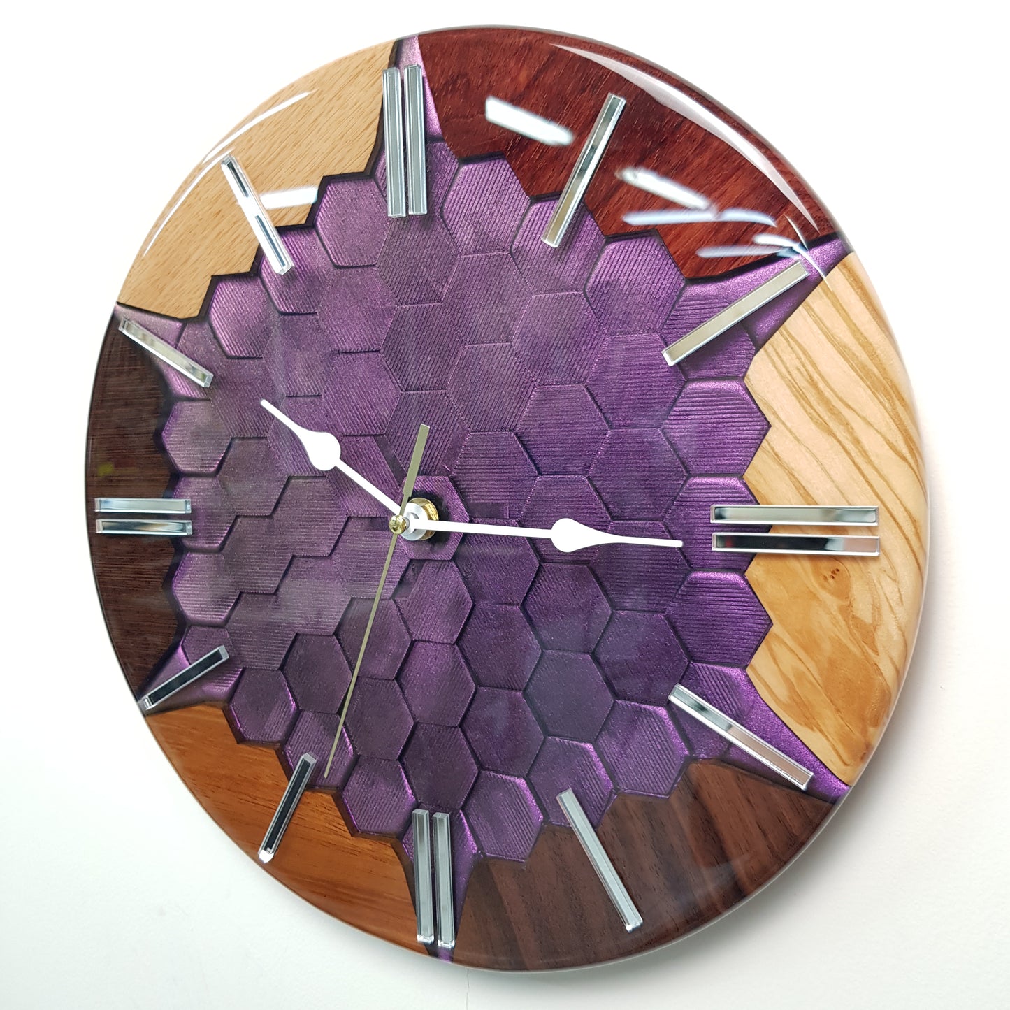Side view of the "Color Mirage" clock highlighting the glossy resin and 3D depth.