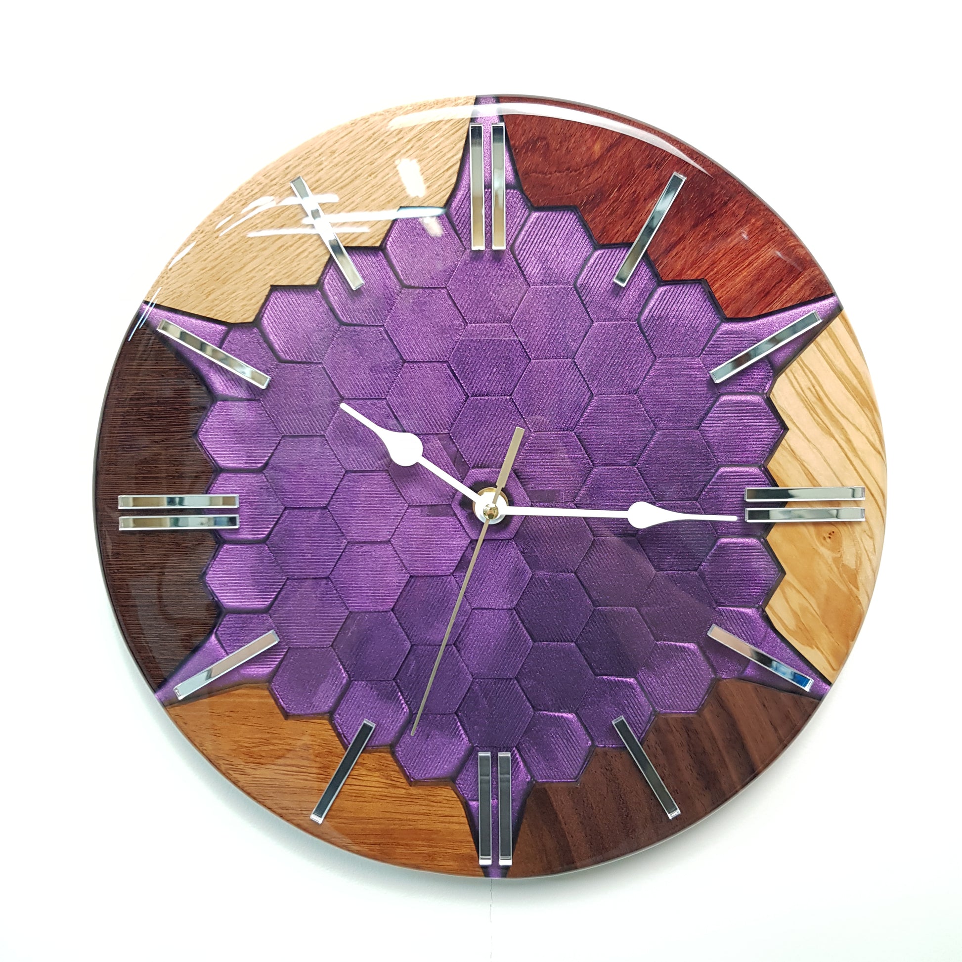 "Color Mirage" clock — front view showing the wood segments and chameleon hexagonal texture.