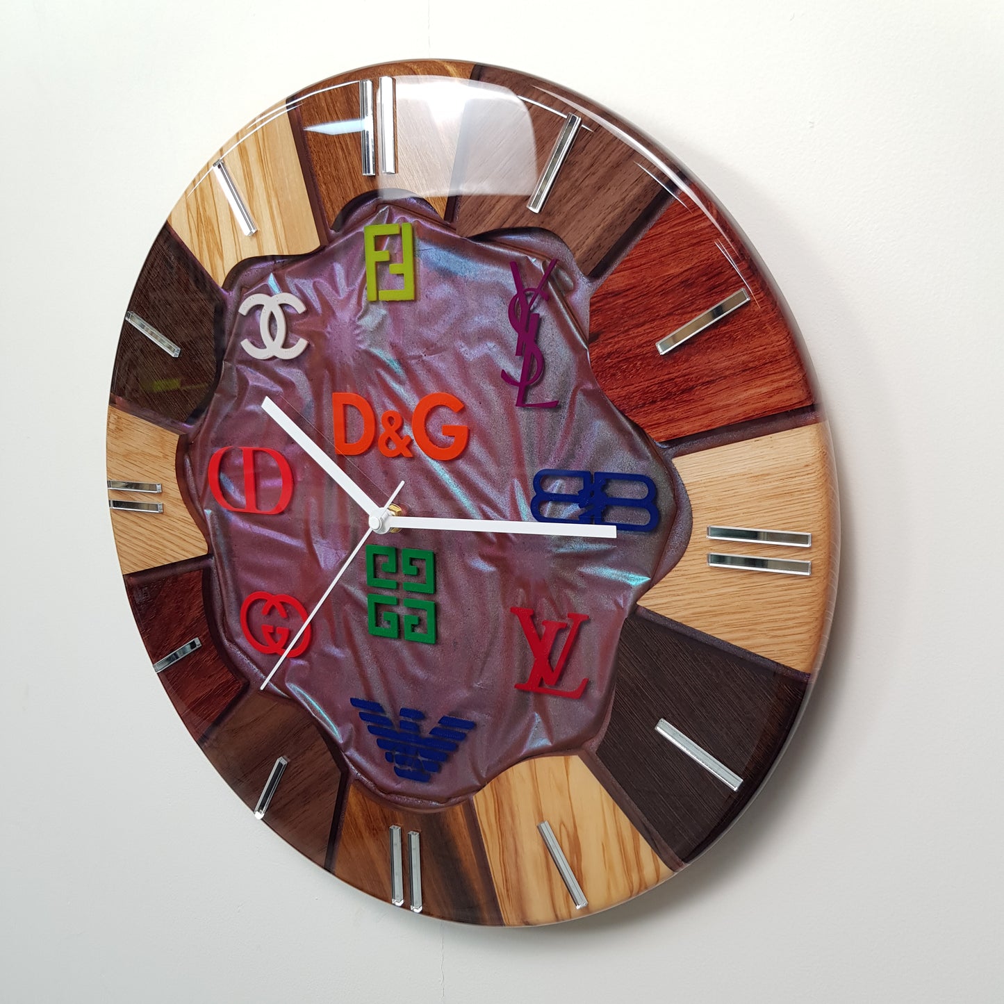 Noble Spectrum luxury art clock displayed on a wall interior setting.