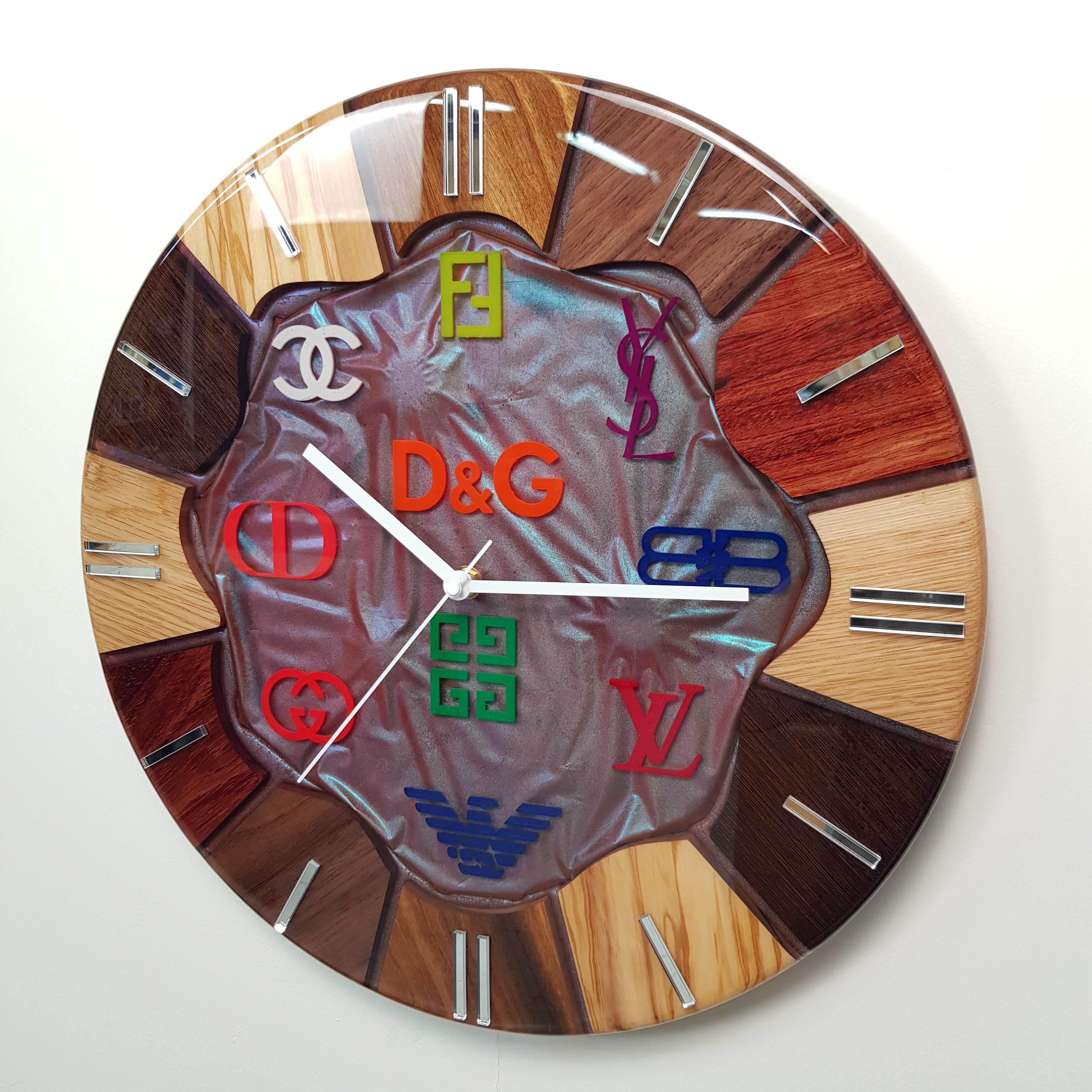 Side angle of the Noble Spectrum clock showing the depth of resin and wooden segments