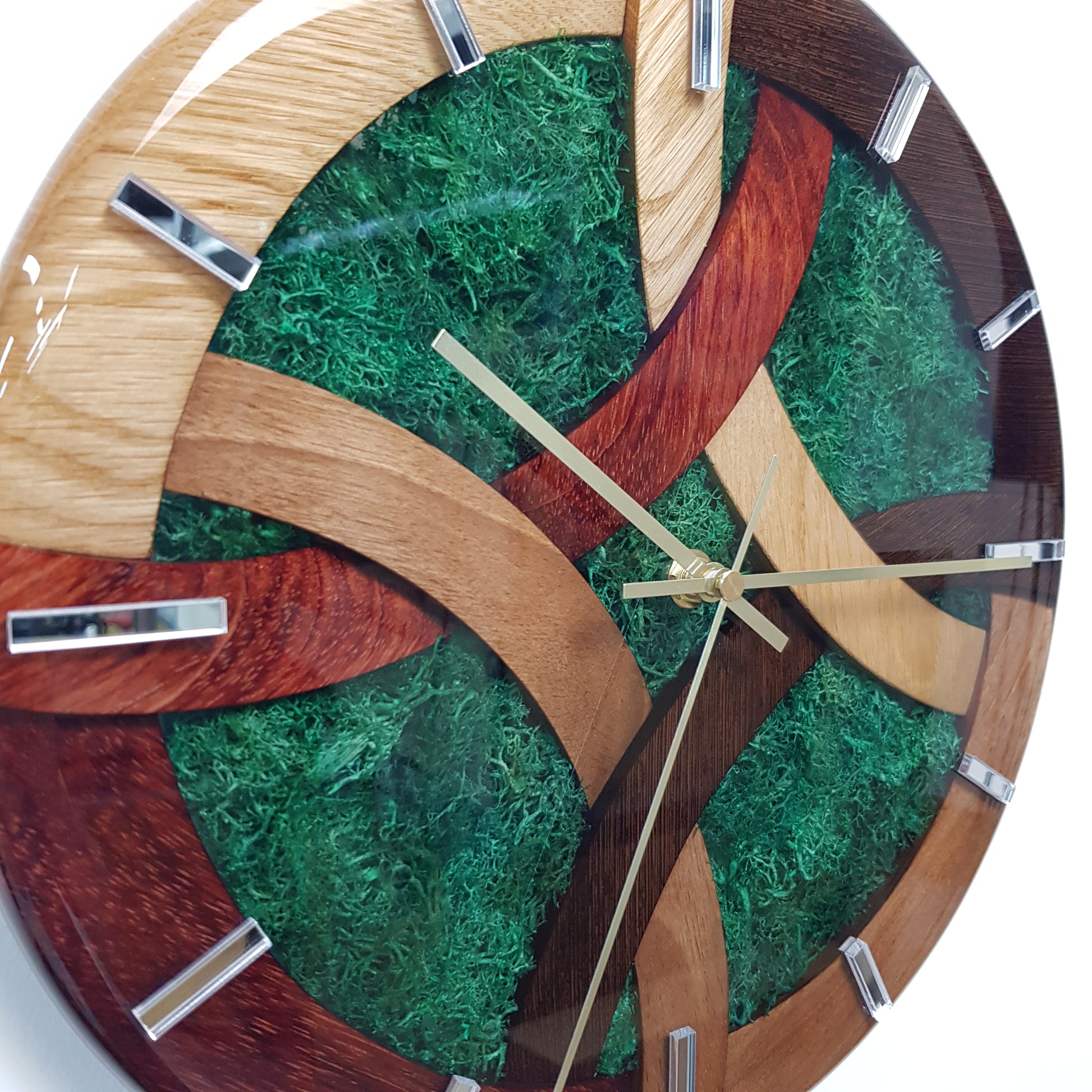 Side angle close-up showing moss texture and wood structure of the clock