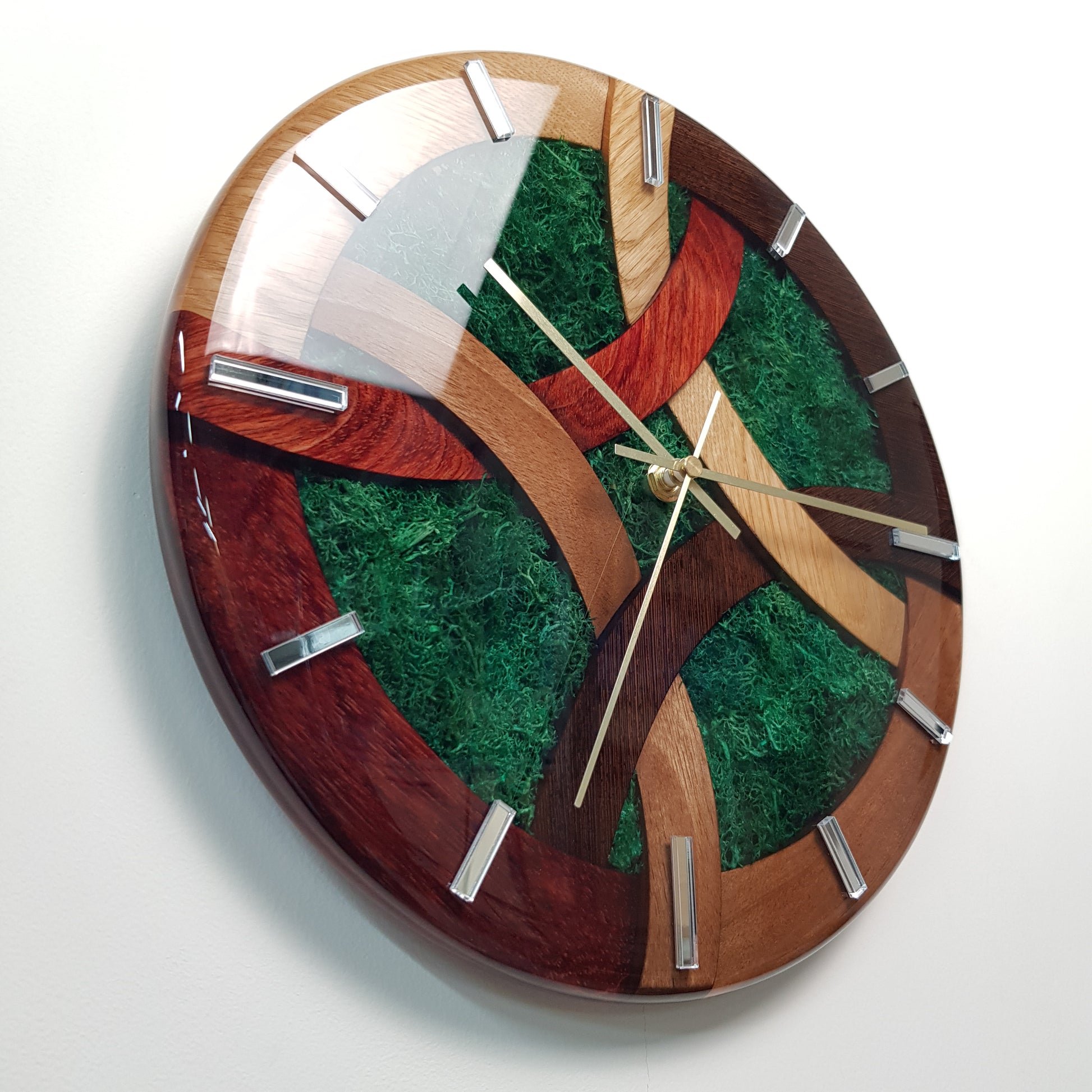 Detailed shot revealing mirrored plexiglass hour markers and wood grain