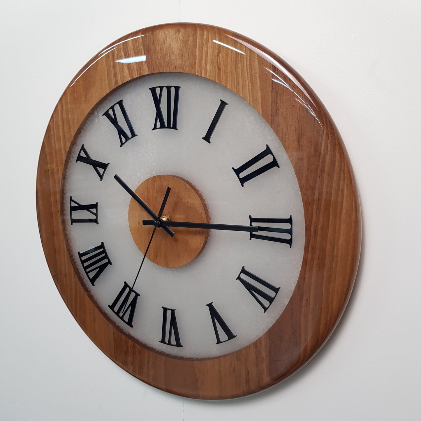 Close-up angled view highlighting walnut wood texture and plexiglass Roman markers.