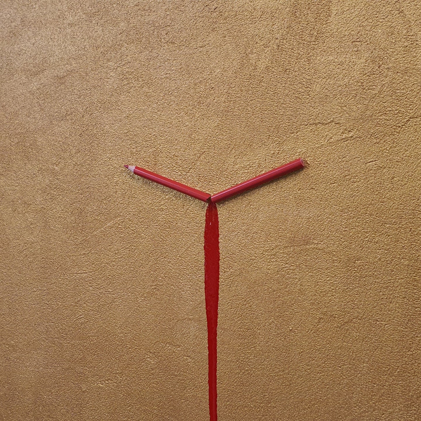 Unique contemporary art piece Un Capitolo Nuovo – handmade resin and pencil installation on gold background, angled photo