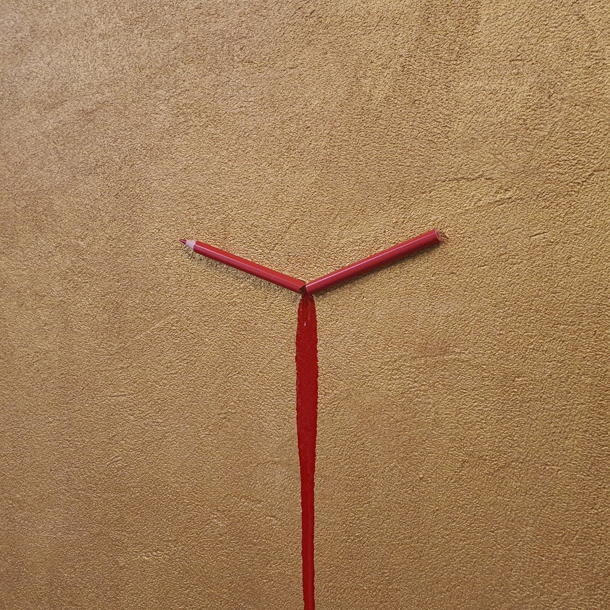 Unique contemporary art piece Un Capitolo Nuovo – handmade resin and pencil installation on gold background, angled photo