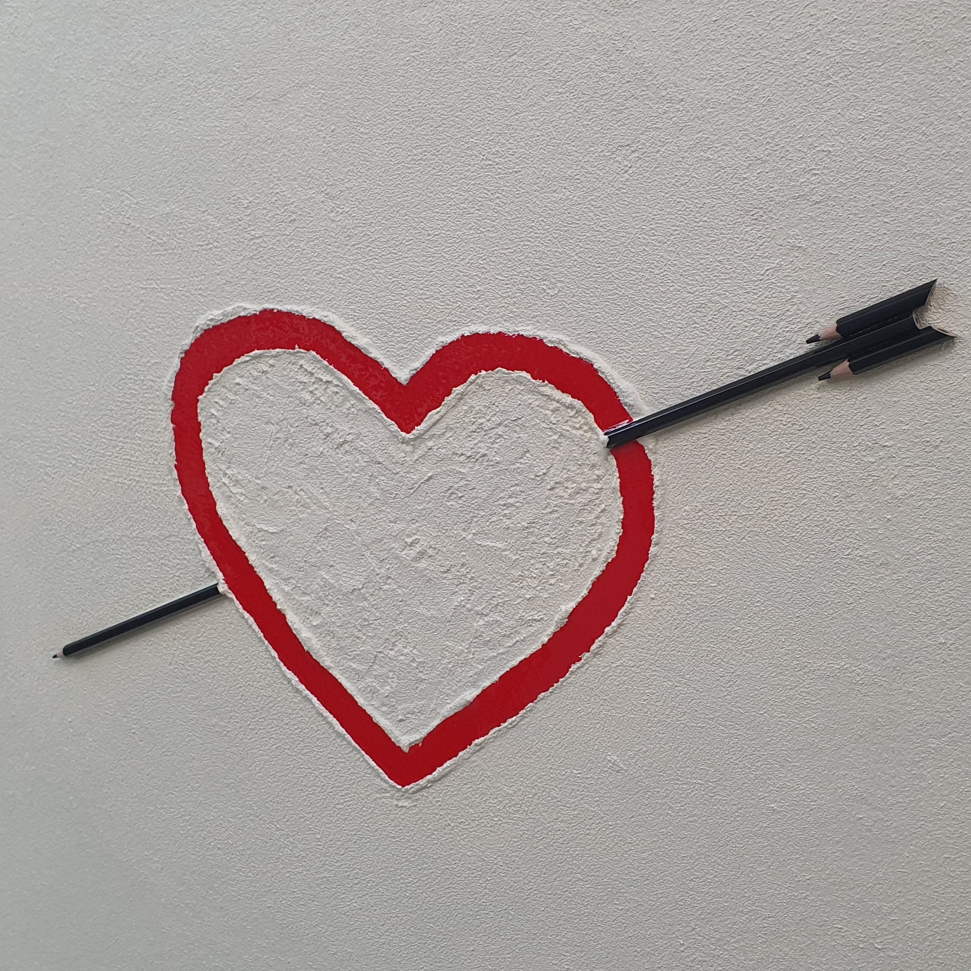 Unique contemporary artwork La Matita nel Cuore – handmade resin and pencil installation with symbolic heart, angled photo