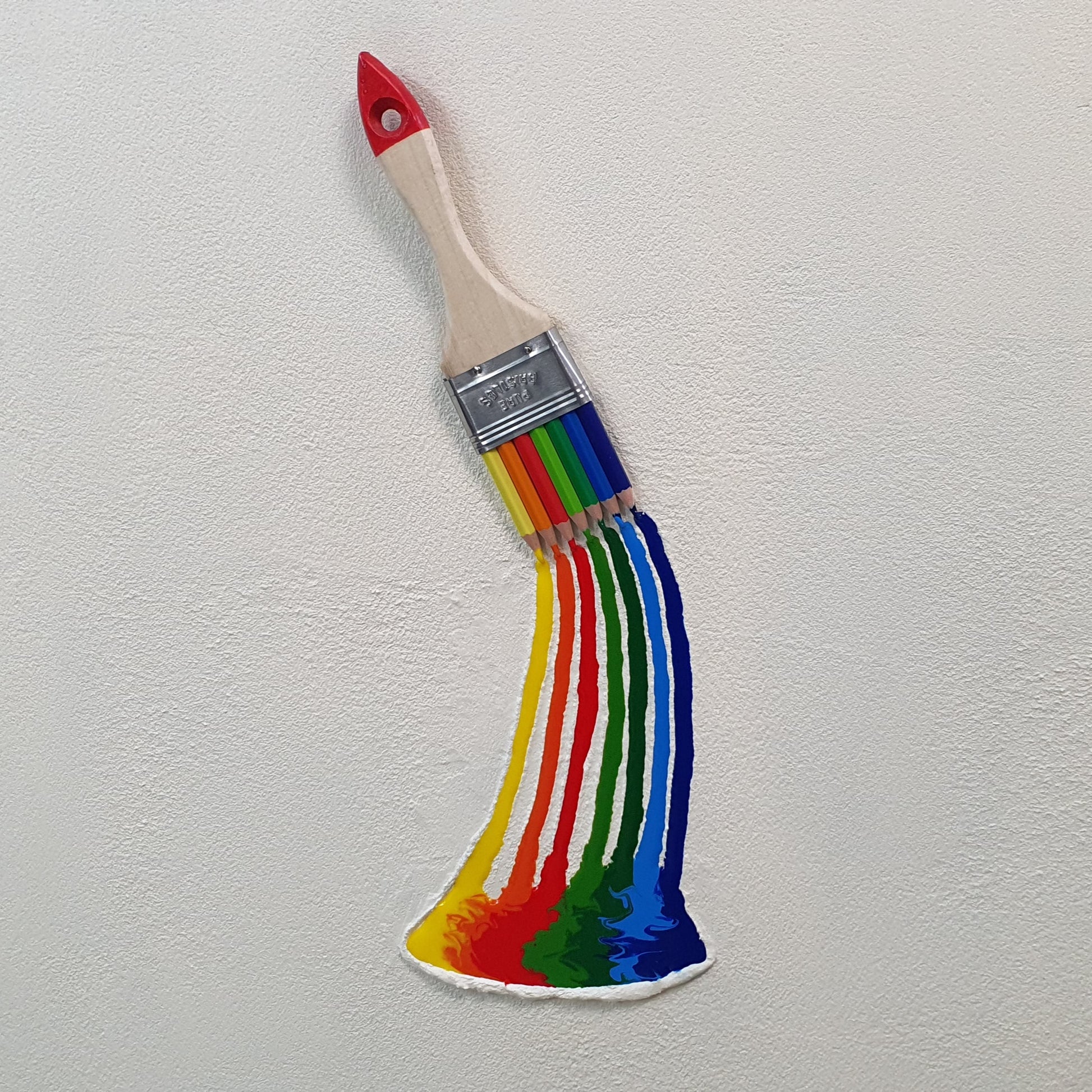 La Forza del Colore resin and colored pencil artwork – close-up detail of paintbrush releasing vivid colors