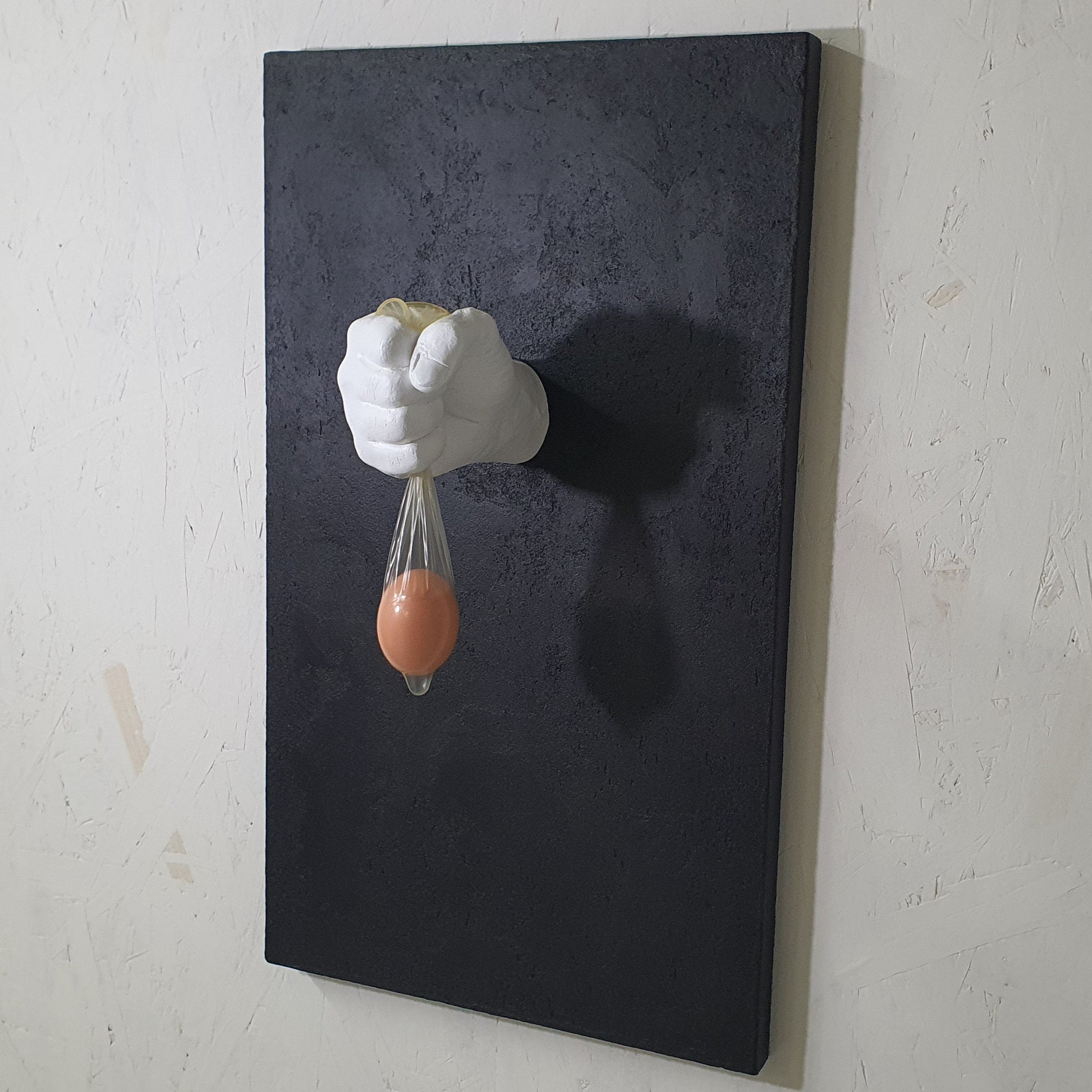 Unique contemporary art piece Vita Protetta – handmade resin and plaster installation exploring fragility of life, angled photo