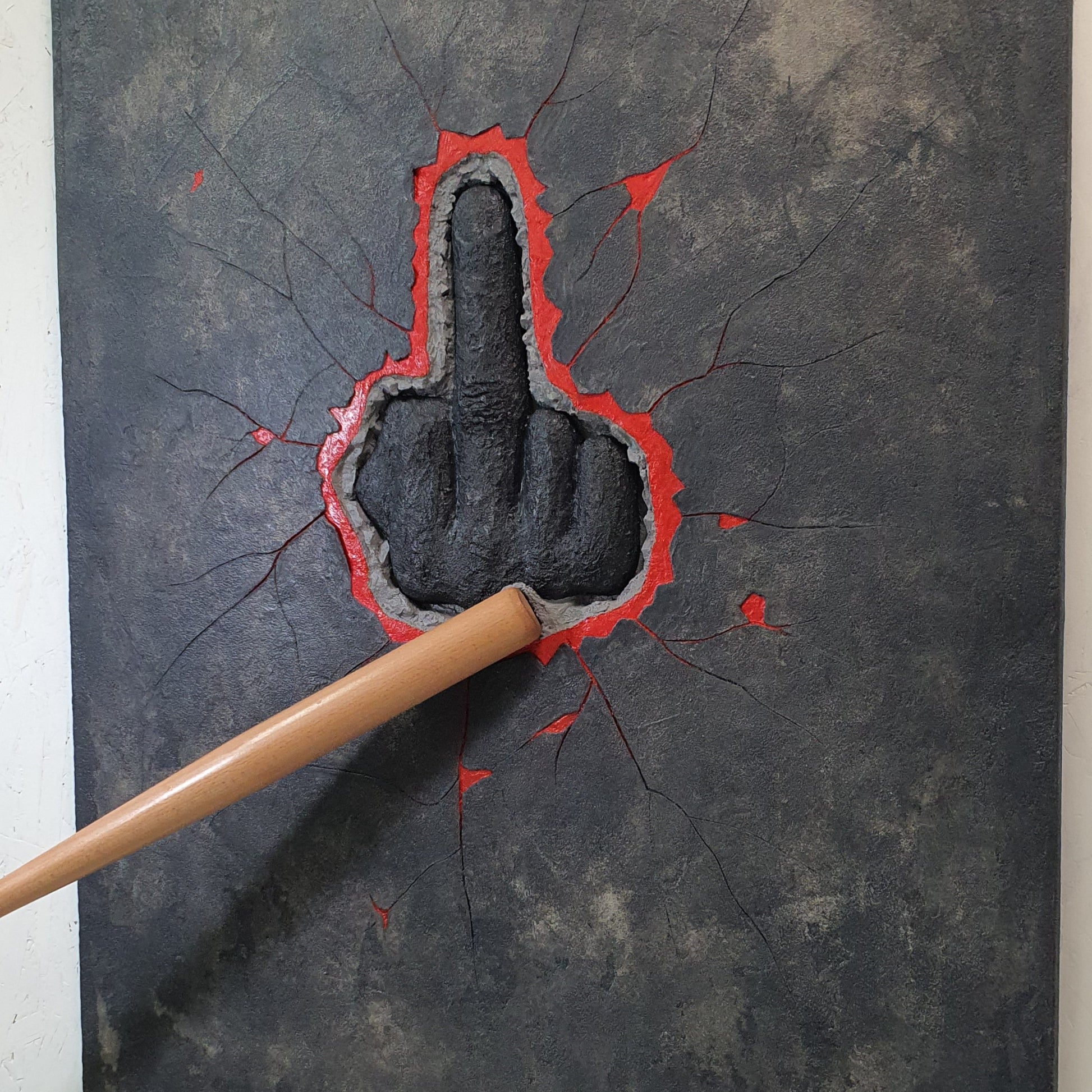 HATER resin and mixed media artwork – close-up detail of red gesture pierced by baseball bat on dark background