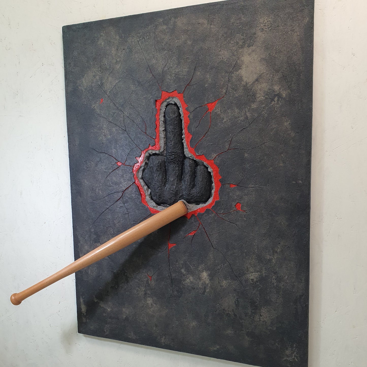 Unique contemporary art piece HATER – handmade resin and mixed media installation with aggressive symbol, angled photo
