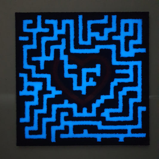 Trovami conceptual artwork – glowing labyrinth with red heart at the center, front view