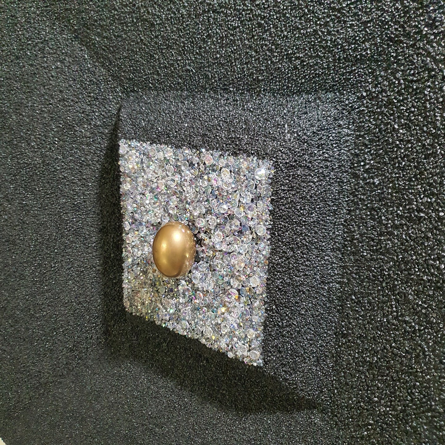 Unique contemporary art piece La Verità Nascosta – handmade mixed media installation with quartz stones and golden egg, angled photo