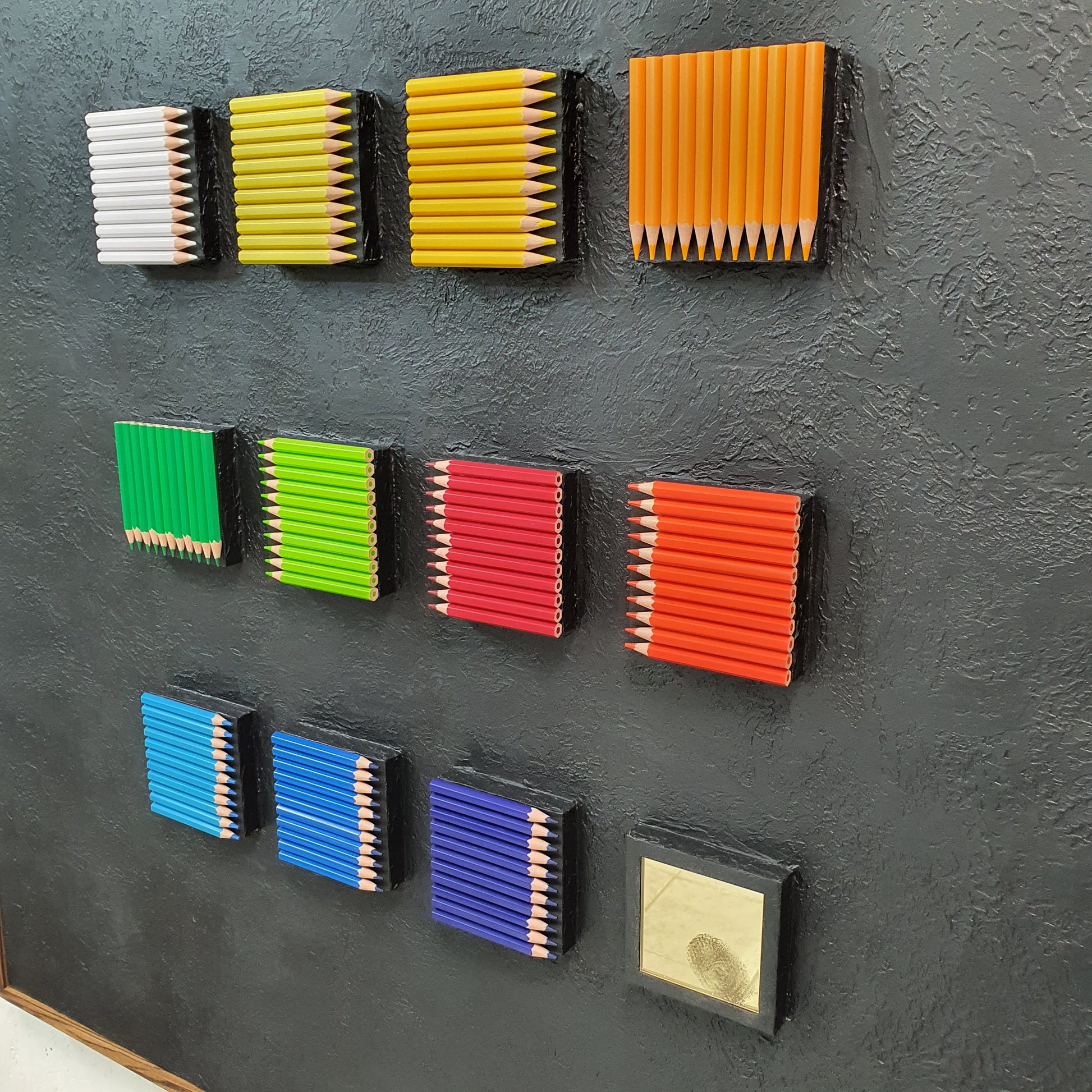 Unique contemporary art piece Identità Ordinata – handmade installation with structured rows of resin pencils, angled photo