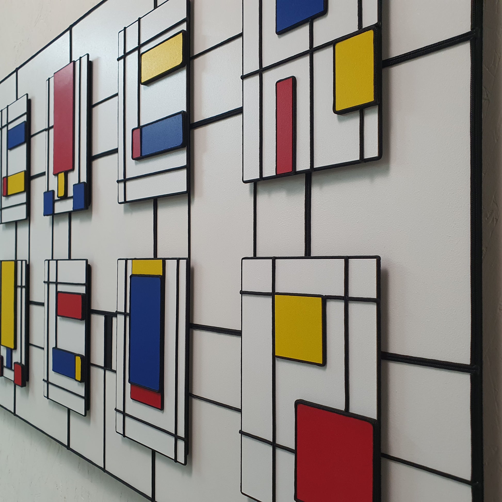 Il Codice Invisibile resin and acrylic artwork – close-up of colorful geometric blocks connected with nylon string