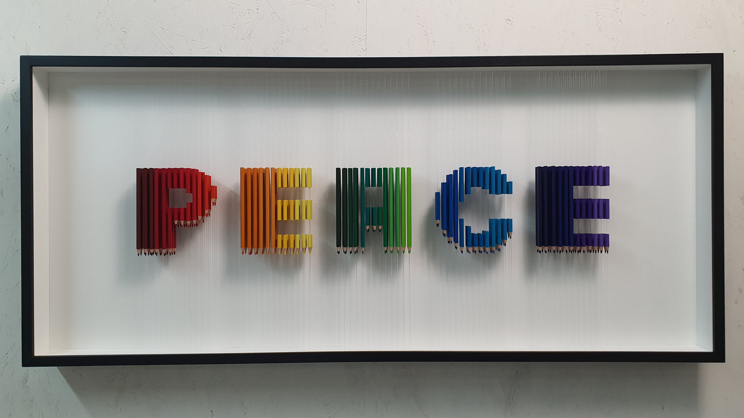 Arcobaleno Sospeso conceptual artwork – suspended rainbow-colored pencils forming the word PEACE, front view