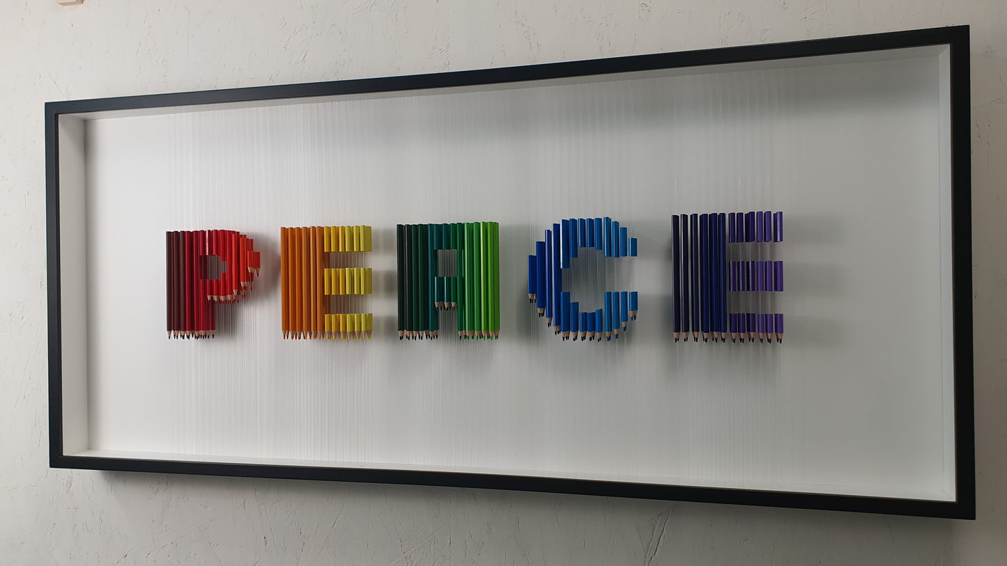 Arcobaleno Sospeso resin and pencil artwork – side view of suspended colorful letters in black frame