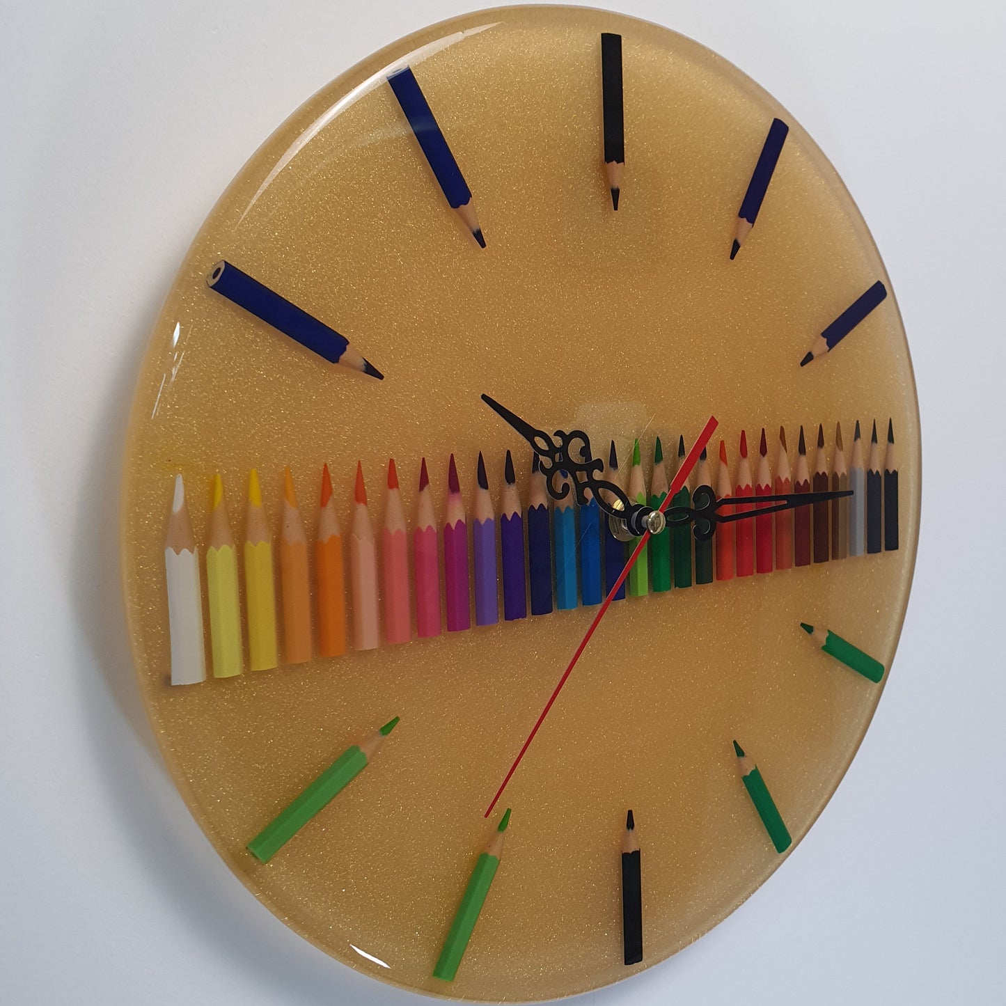Side angle of resin wall clock showing 3D colored pencil texture