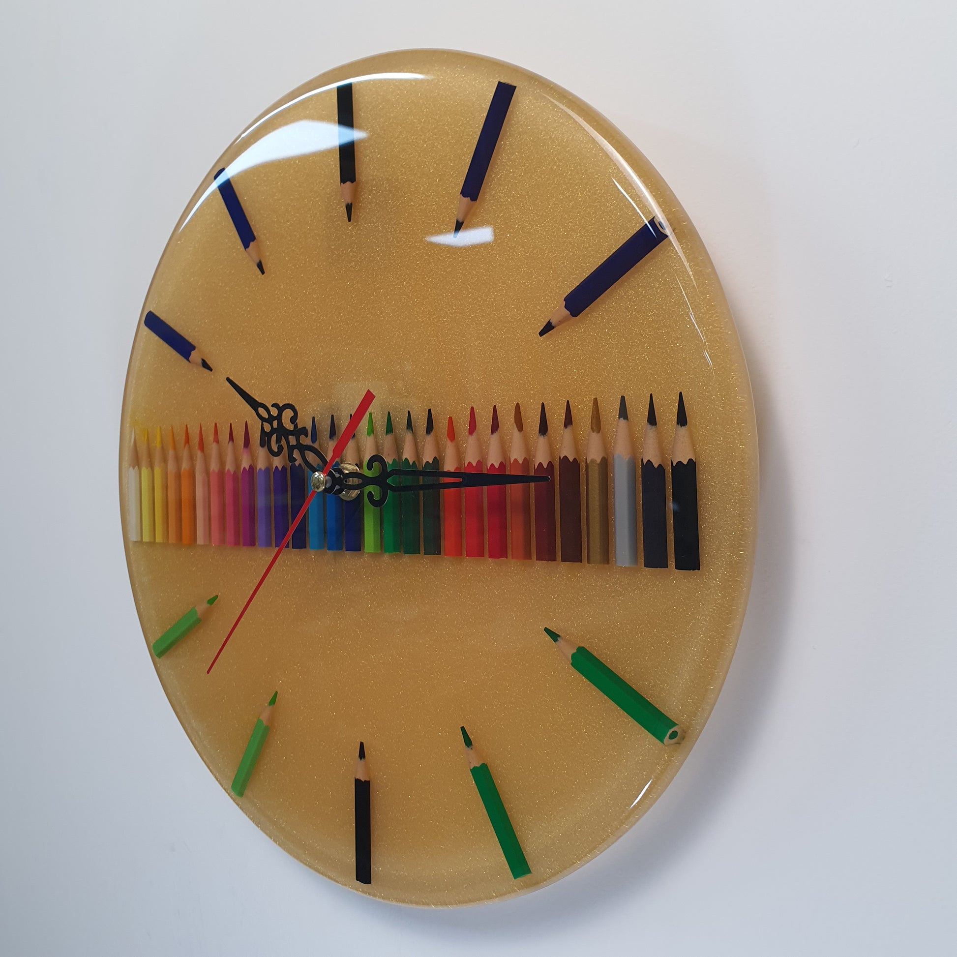 Handcrafted epoxy wall clock with vibrant pencils – side view