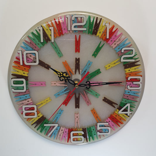 Front view of the Happy Pegs epoxy wall clock with colorful pegs