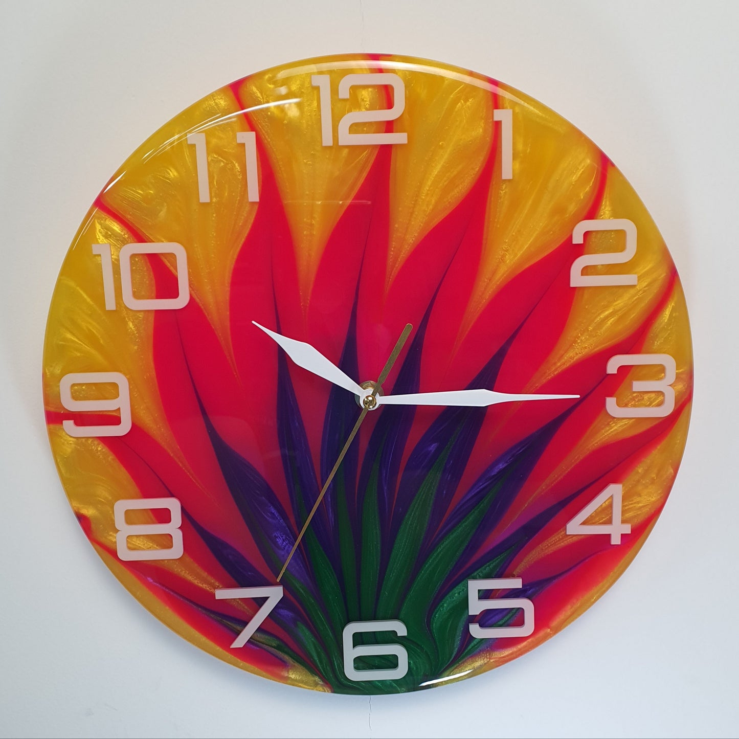 Front view of the “Tropic Blaze” resin wall clock showing its vivid abstract pattern
