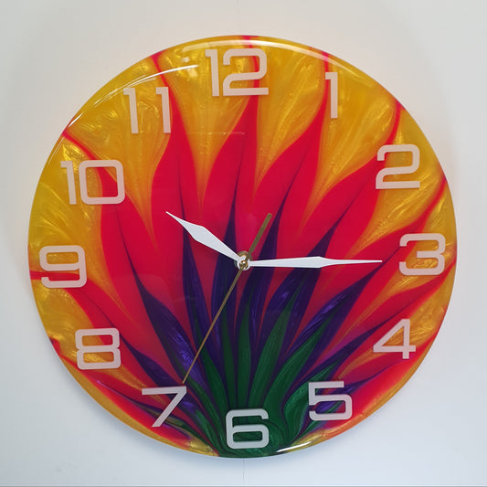 Front view of the “Tropic Blaze” resin wall clock showing its vivid abstract pattern