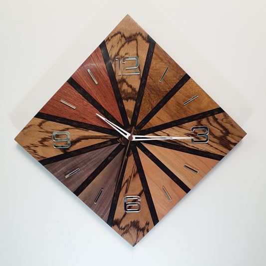 Front view of the “Wood Line – Natural Pulse” wall clock showing its radial wood pattern and mirrored numbers